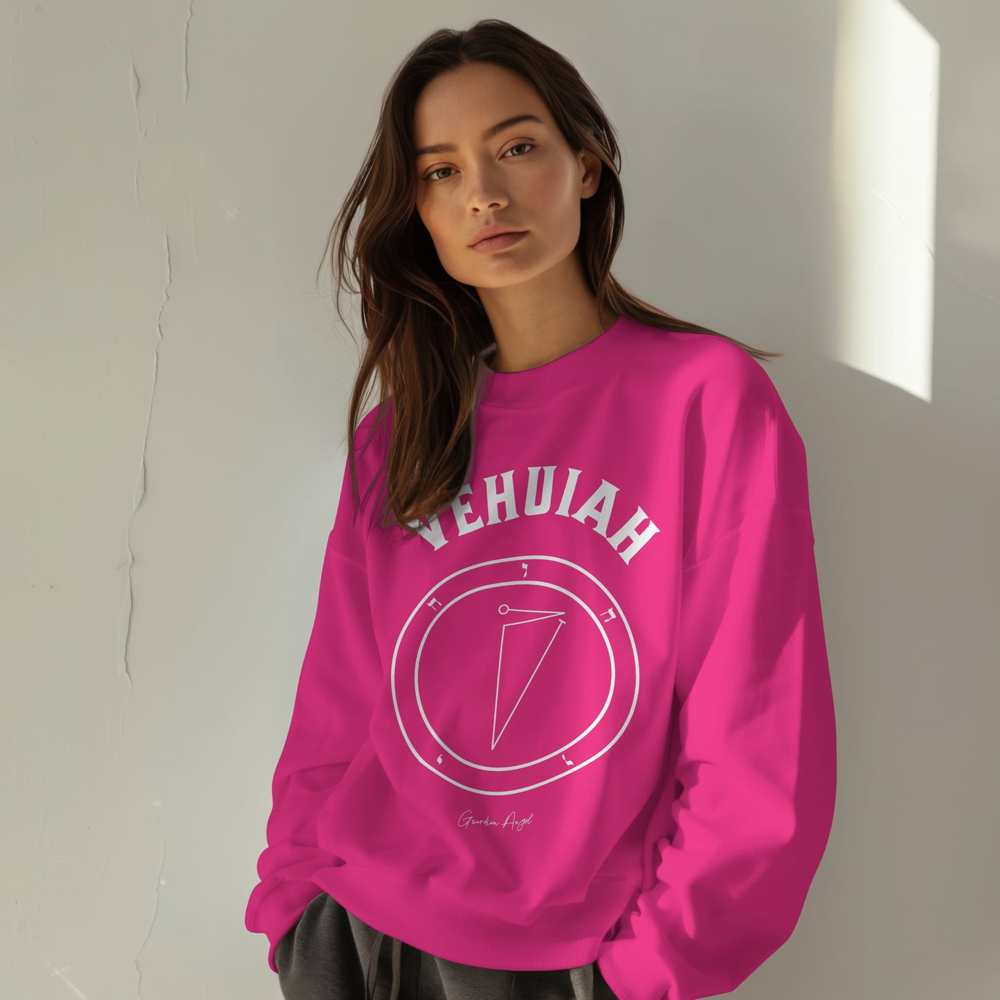 Model wearing a No.1 Vehuiah Hamephorash Guardian Angel Sweatshirt in Heliconia Pink with seal of Vehuiah on the front in white.