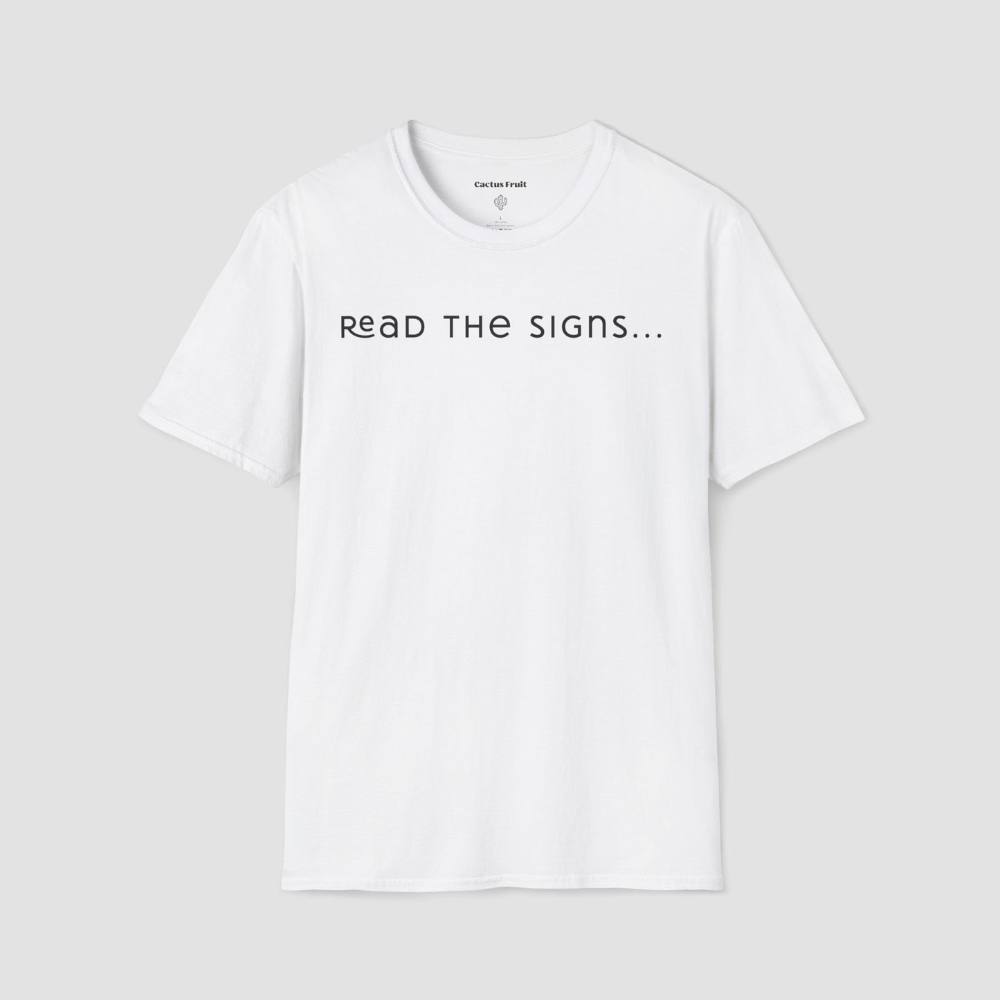 White t-shirt with 'READ THE SIGNS...' text on a light gray background
