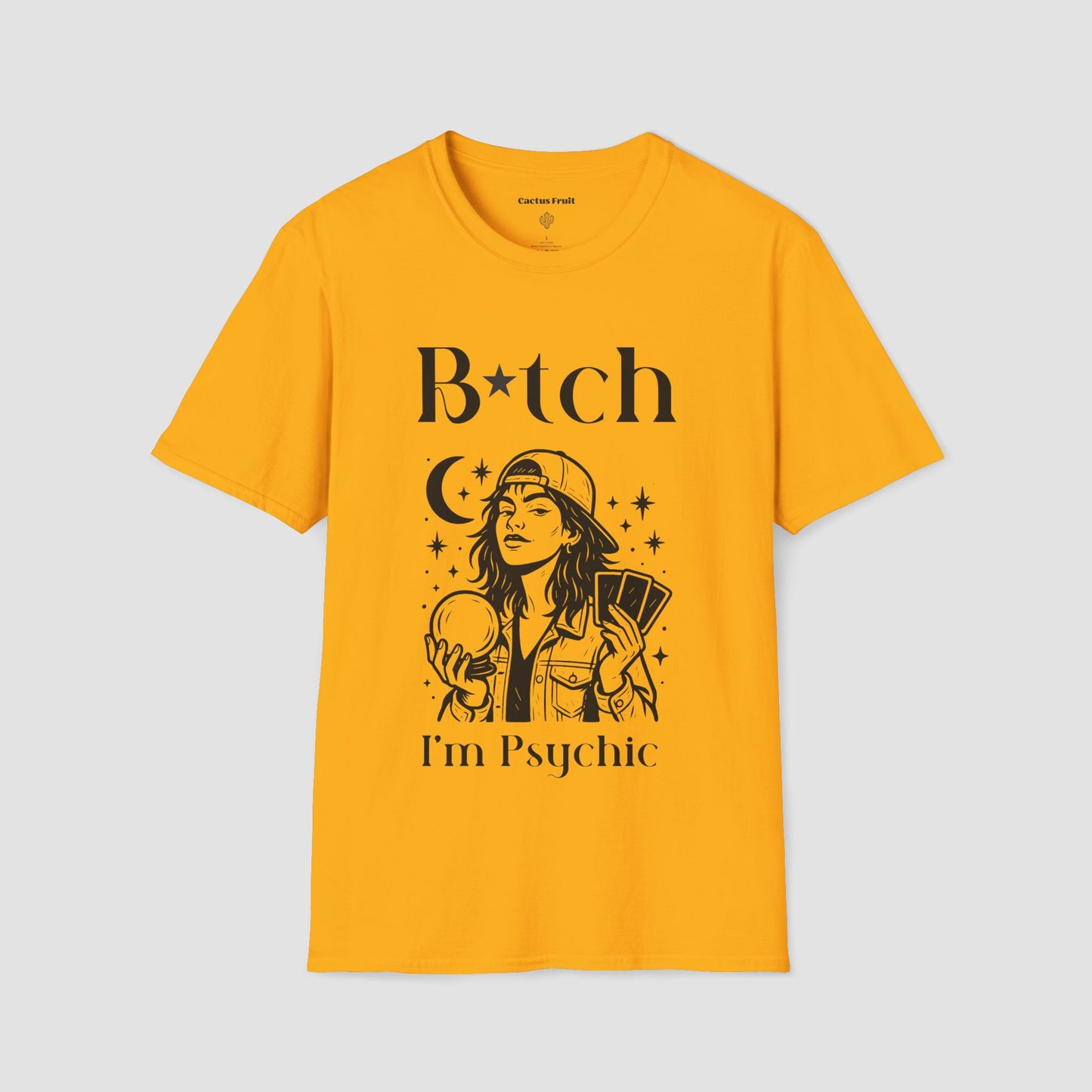 Bitch I'm Psychic T-shirt in colour Daisy with a graphic of a girl in baseball cap holding a Crystal Ball in one hand, and Tarot cards in the other hand.