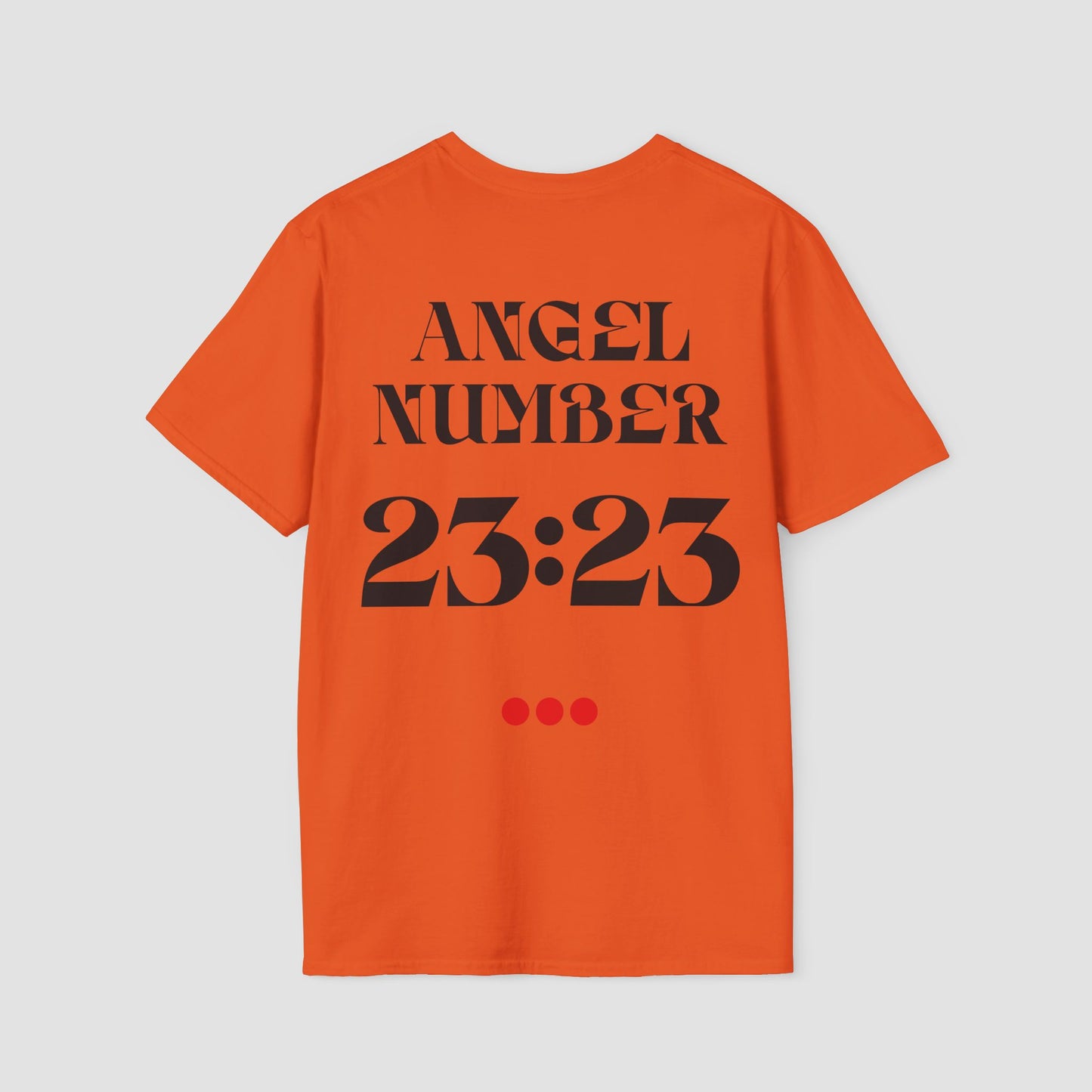 Orange Tee with Angel Number 23:23 depicted on the back in black print and underscored by 3 red dots. A slogan is written across the front saying, "Read the signs" .