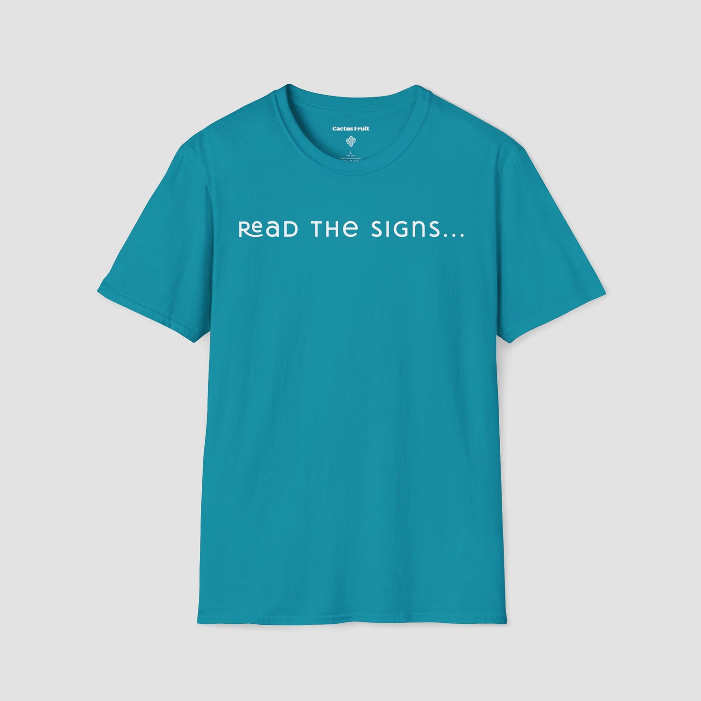 Teal t-shirt with 'Read the Signs...' text on a light gray background