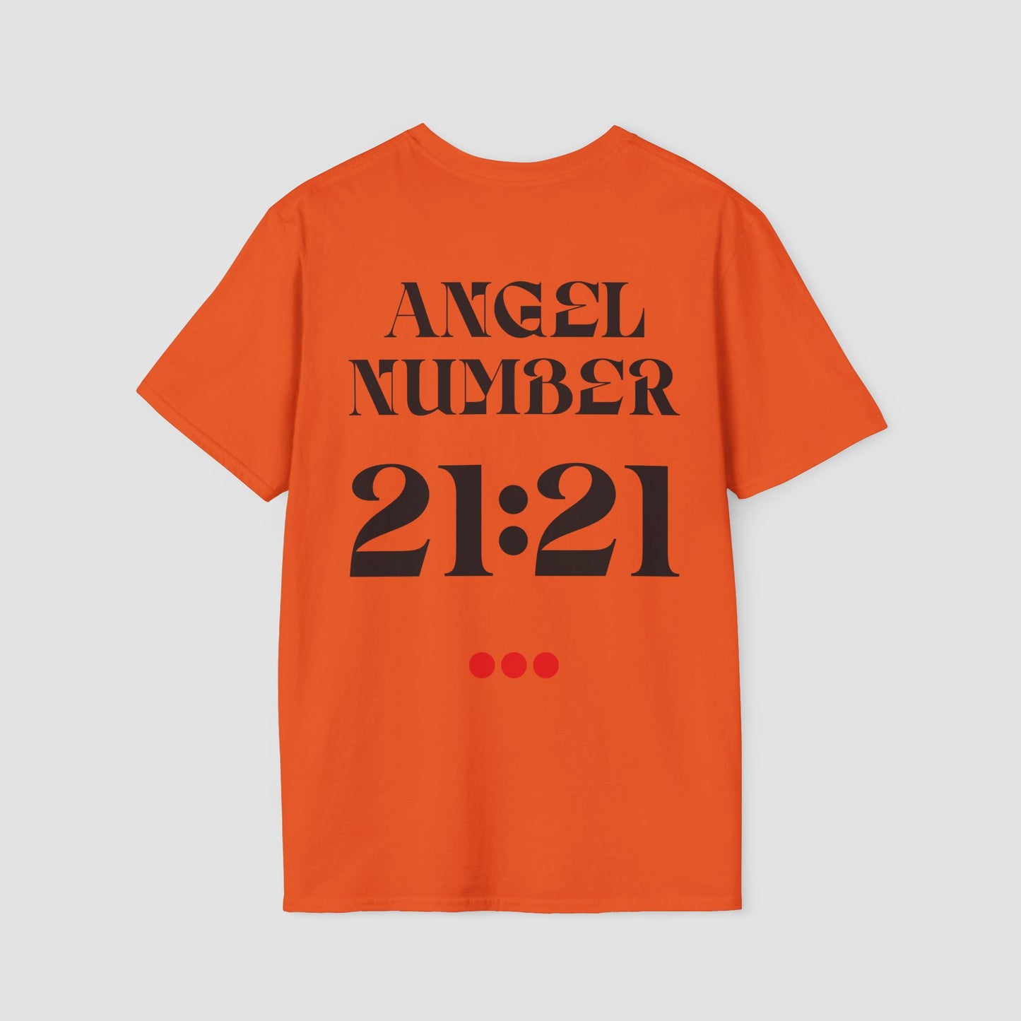 Orange coloured Tee with Angel Number 21:21 depicted on the back in black print and underscored by 3 red dots. A slogan is written across the front saying, "Read the signs" .
