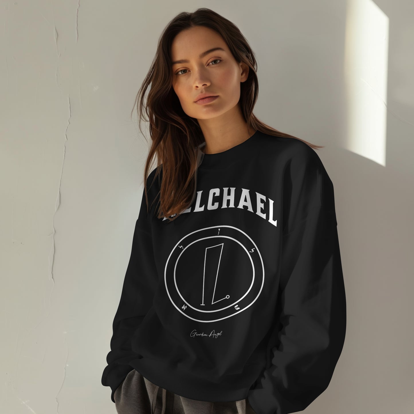 Model wearing aNo.21 Shemhamphorasch Guardian Angel "Nelchael" Sweatshirt in Black. With the seal of Nelchael in white print on the front.