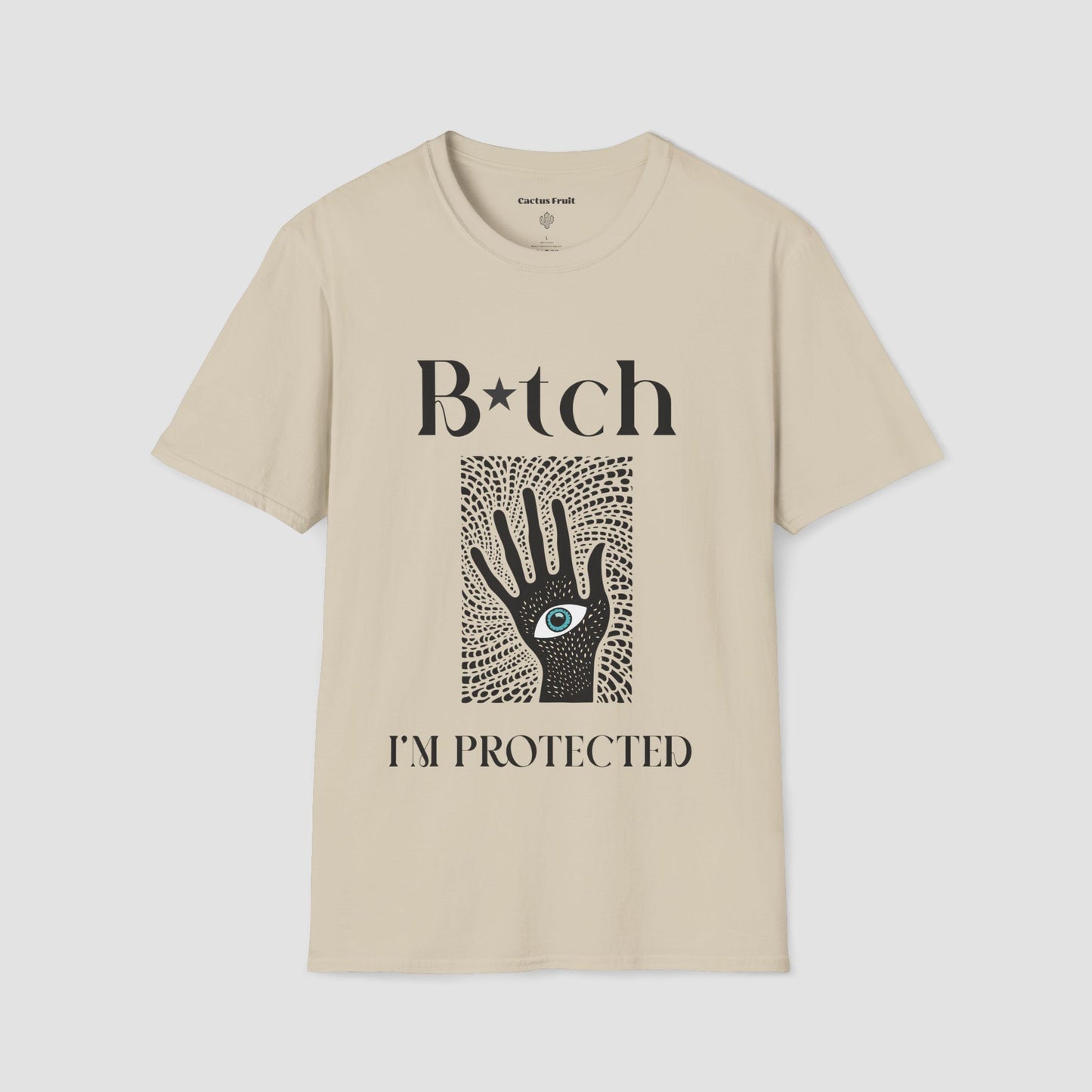 Sand coloured t-shirt featuring the black silhouette of a hand with an evil eye emblem on the palm - surrounded by the slogan, "Bitch I'm Protected"