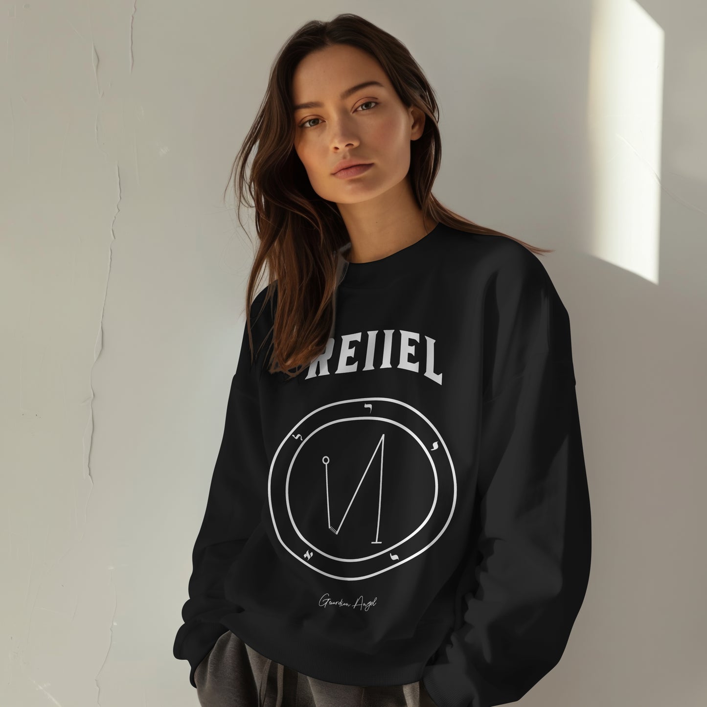 Model wearing a No.29 Shemhamphorasch Guardian Angel "Reiiel" Sweatshirt in Black. With the seal of Reiiel in white print on the front.