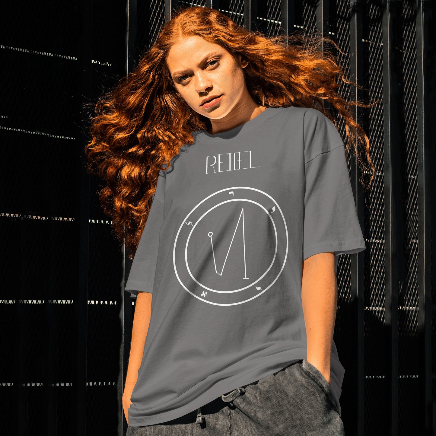 Model wearing No.29 Reiiel Shem Hamephorash Guardian Angel T-Shirt in charcoal with symbol of Reiiel on front.