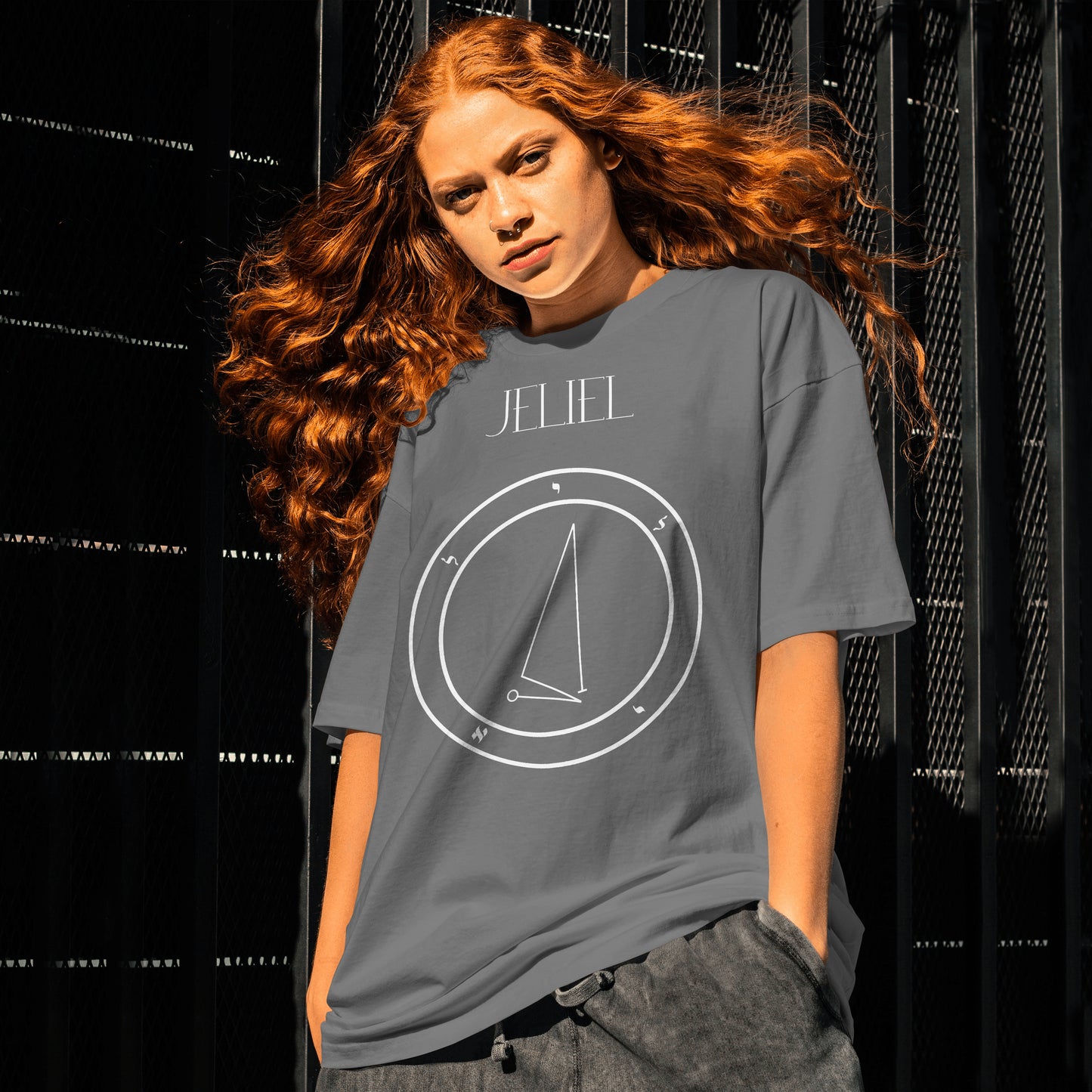 Model wearing No.2._Jeliel Shem Hamephorash Guardian Angel T-Shirt in charcoal with symbol of Jeliel on front.
