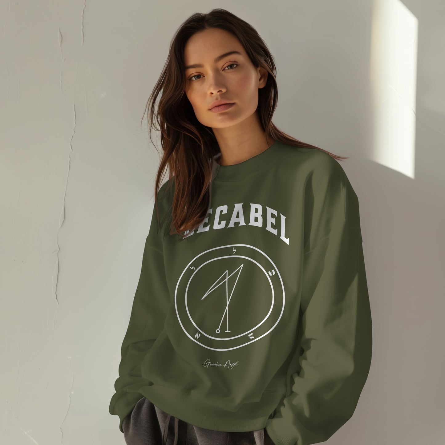 Model wearing a No.31 Shemhamphorasch Guardian Angel "Lecabel" Sweatshirt in Military Green. With the seal of Lecabel in white print on the front.