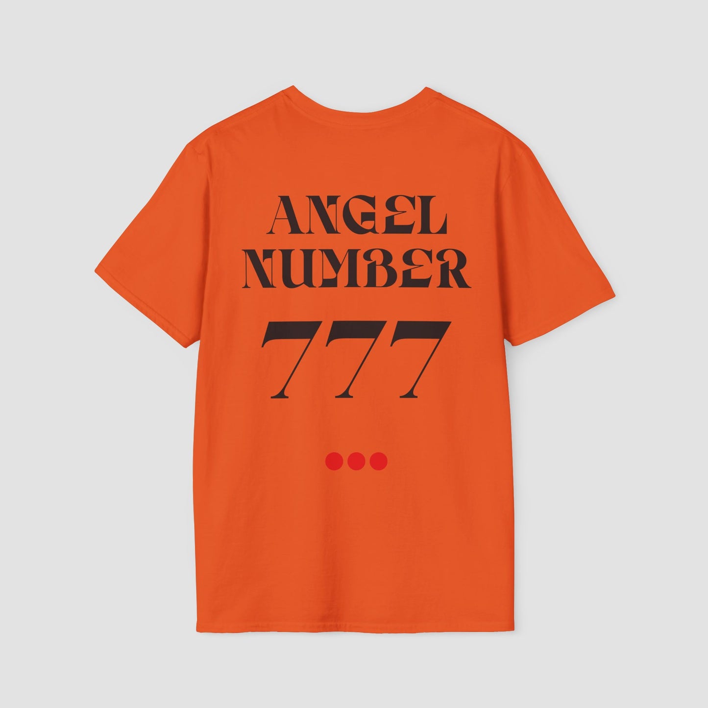 Orange coloured Tee with Angel Number 777 depicted on the back in black print and underscored by 3 red dots. A slogan is written across the front saying, "Read the signs" .