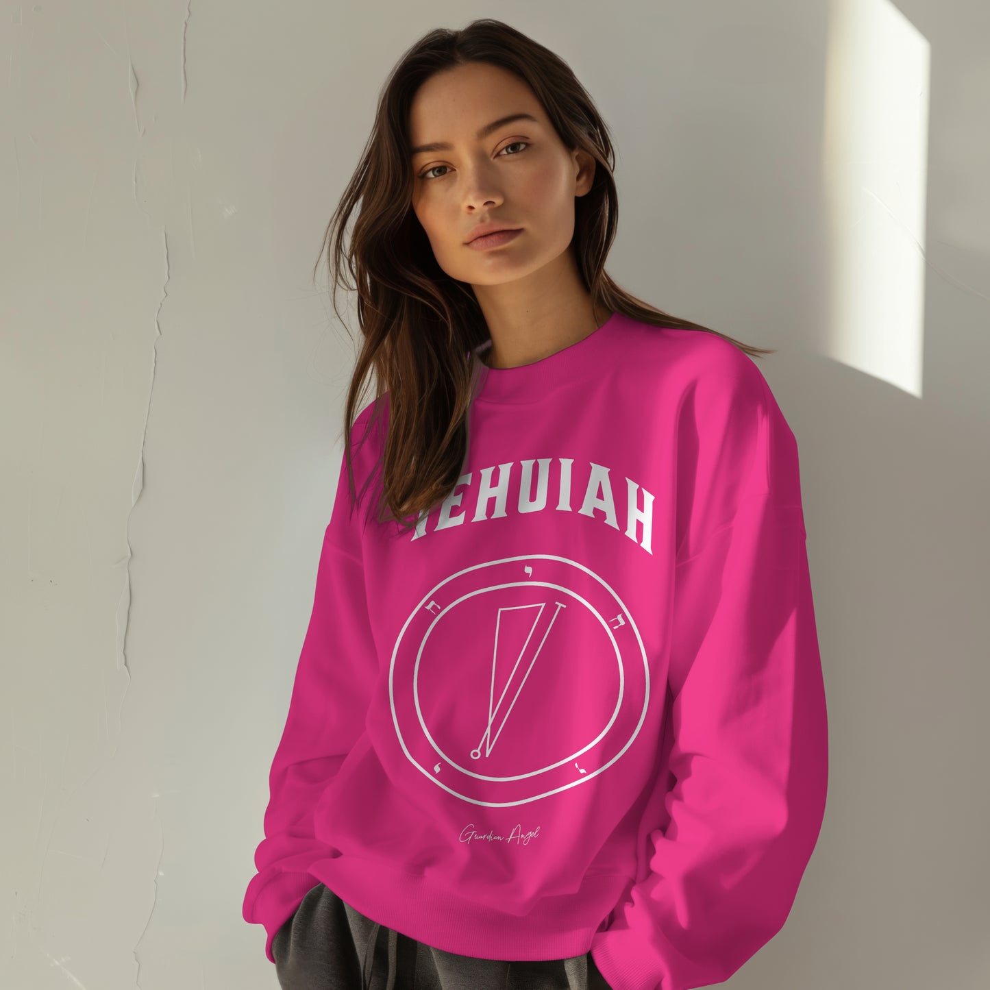 Model wearing a No.33 Shemhamphorasch Guardian Angel "Iehuiah" Sweatshirt in Heliconia Pink. With the seal of Iehuiah in white print on the front.