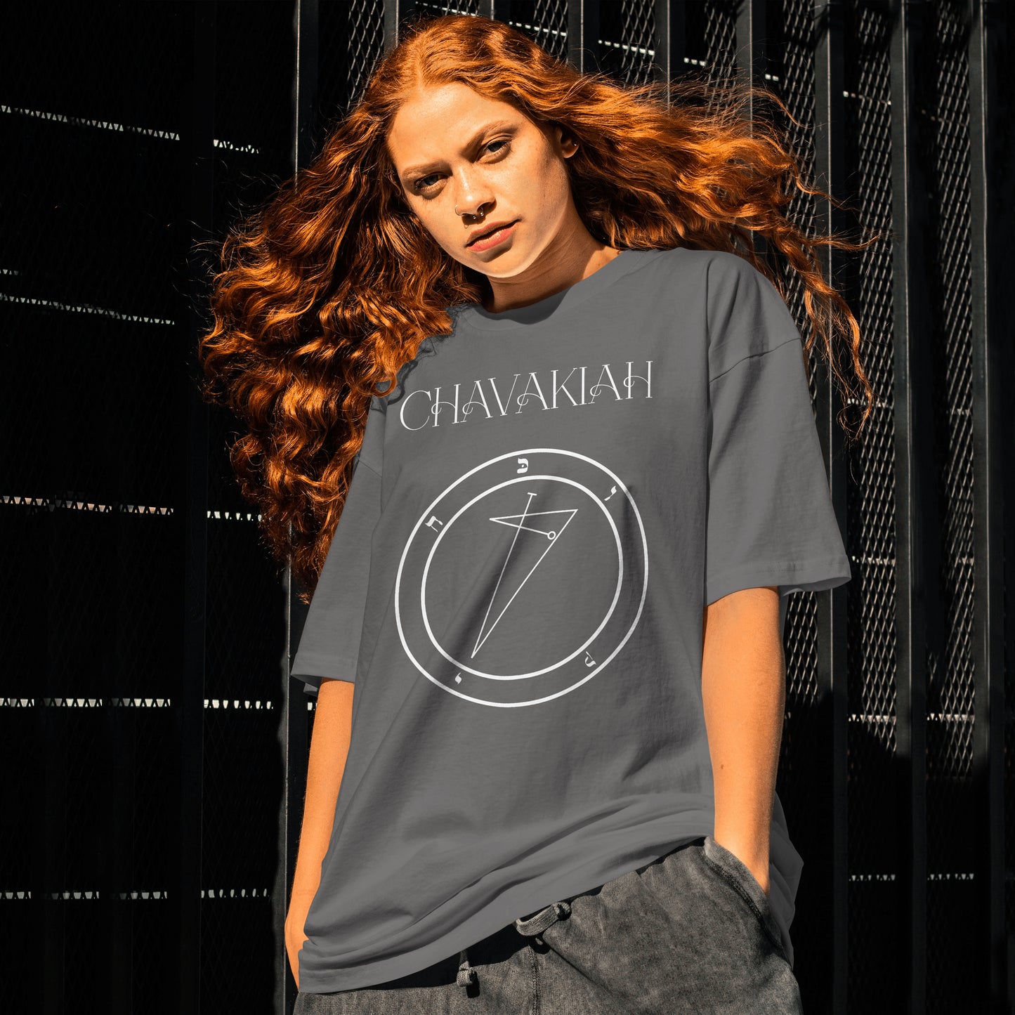 Model wearing No.35 Chavakiah Shem Hamephorash Guardian Angel T-Shirt in charcoal with symbol of Chavakiah on front.