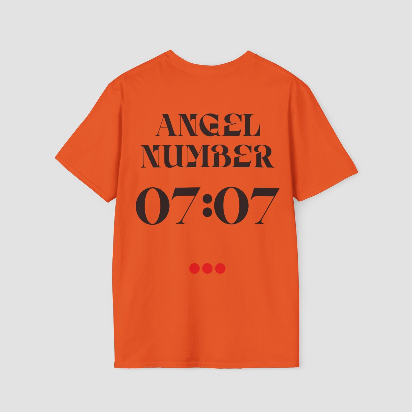 Orange t-shirt with 'ANGEL NUMBER 07:07' printed on the back against a light gray background