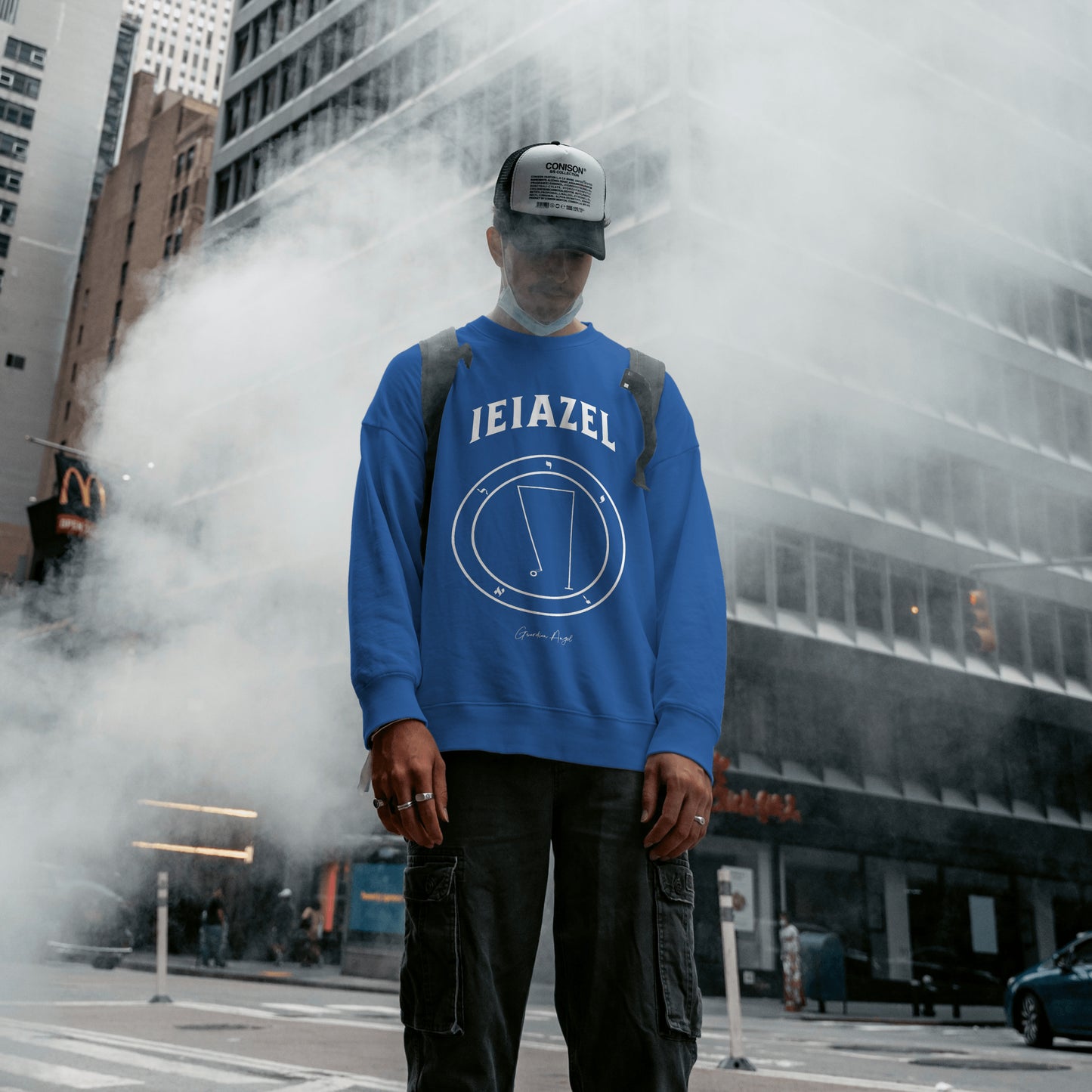 Model wearing a No.40 Shemhamphorasch Guardian Angel "Ieiazel" Sweatshirt in Royal Blue. With the seal of Ieiazel in white print on the front.