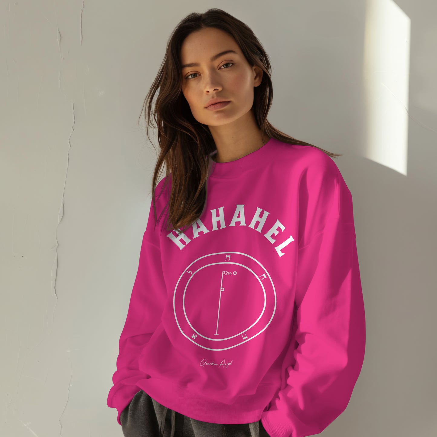 Model wearing a No.41 Shemhamphorasch Guardian Angel "Hahahel" Sweatshirt in Heliconia Pink. With the seal of Hahahel in white print on the front.