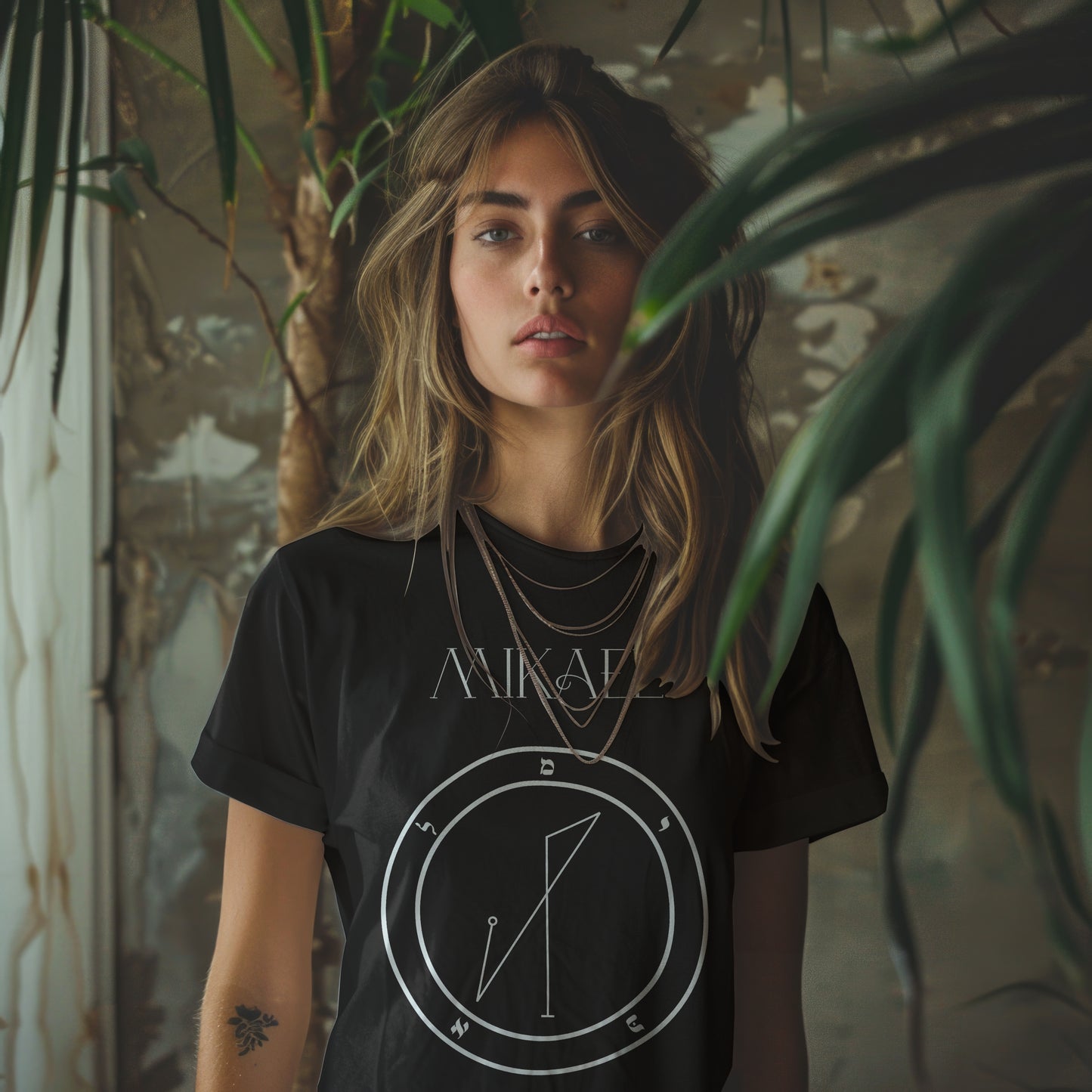 Model wearing No.42 Mikael Shem Hamephorash Guardian Angel T-Shirt in black with symbol of Mikael on front.