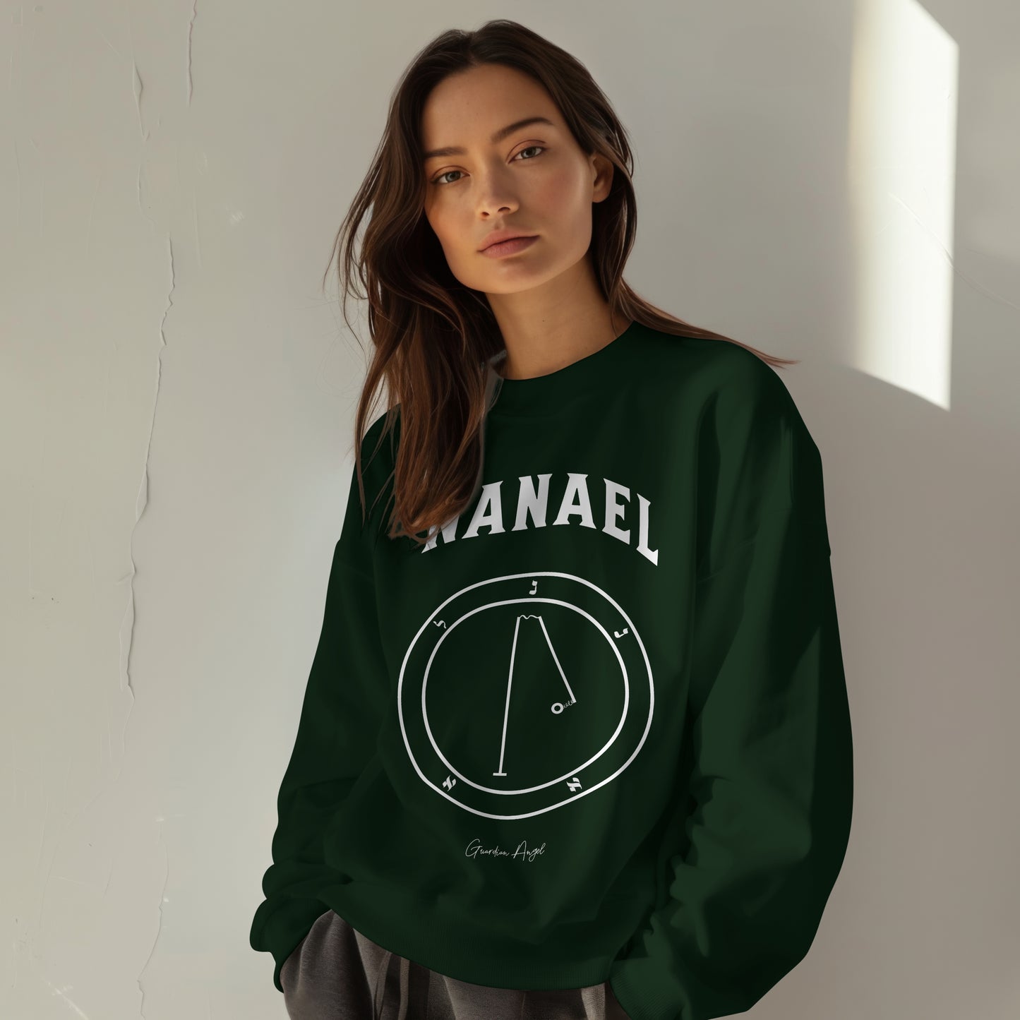 Model wearing a No.53 Shemhamphorasch Guardian Angel "Nanael" Sweatshirt in Forest Green. With the seal of Nanael in white print on the front.
