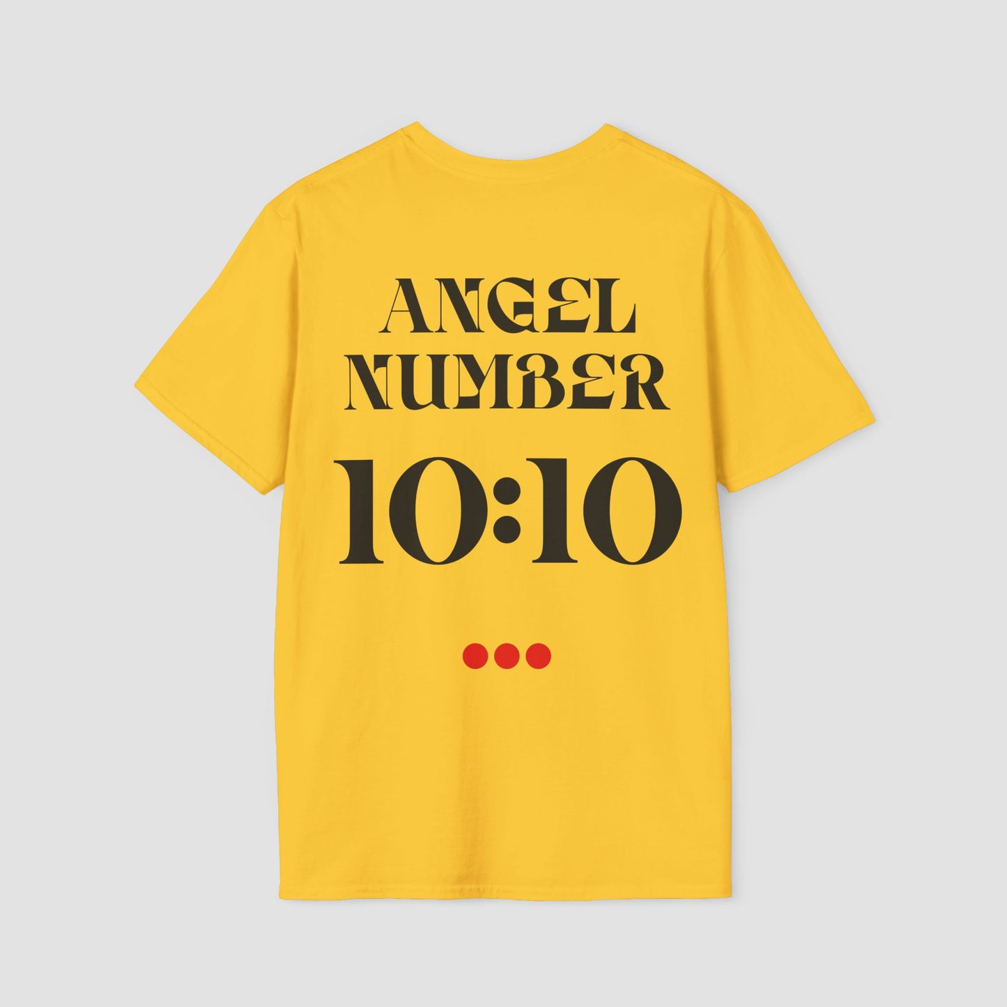 Yellow t-shirt with 'ANGEL NUMBER 10:10' printed on the back against a light gray background