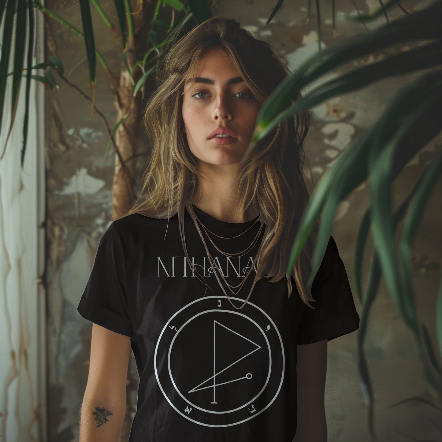 Model wearing No.54 Nithanael Shem Hamephorash Guardian Angel T-Shirt in black with symbol of Nithanael on front.