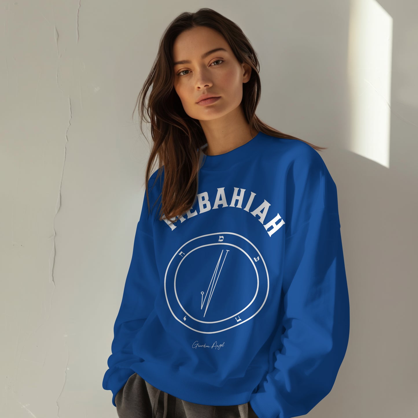 Model wearing a No.55 Shemhamphorasch Guardian Angel "Mebahiah" Sweatshirt in Royal Blue. With the seal of Mebahiah in white print on the front.