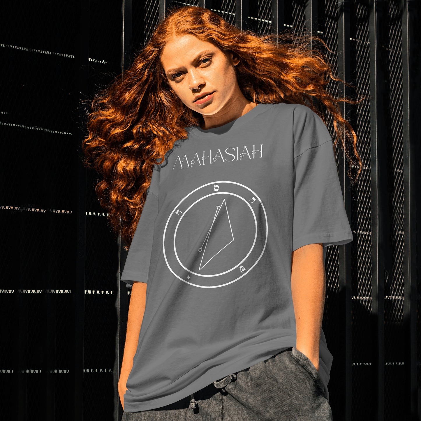Model wearing No.5_Mahasiah Shem Hamephorash Guardian Angel T-Shirt in charcoal with symbol of Mahasiah on front.