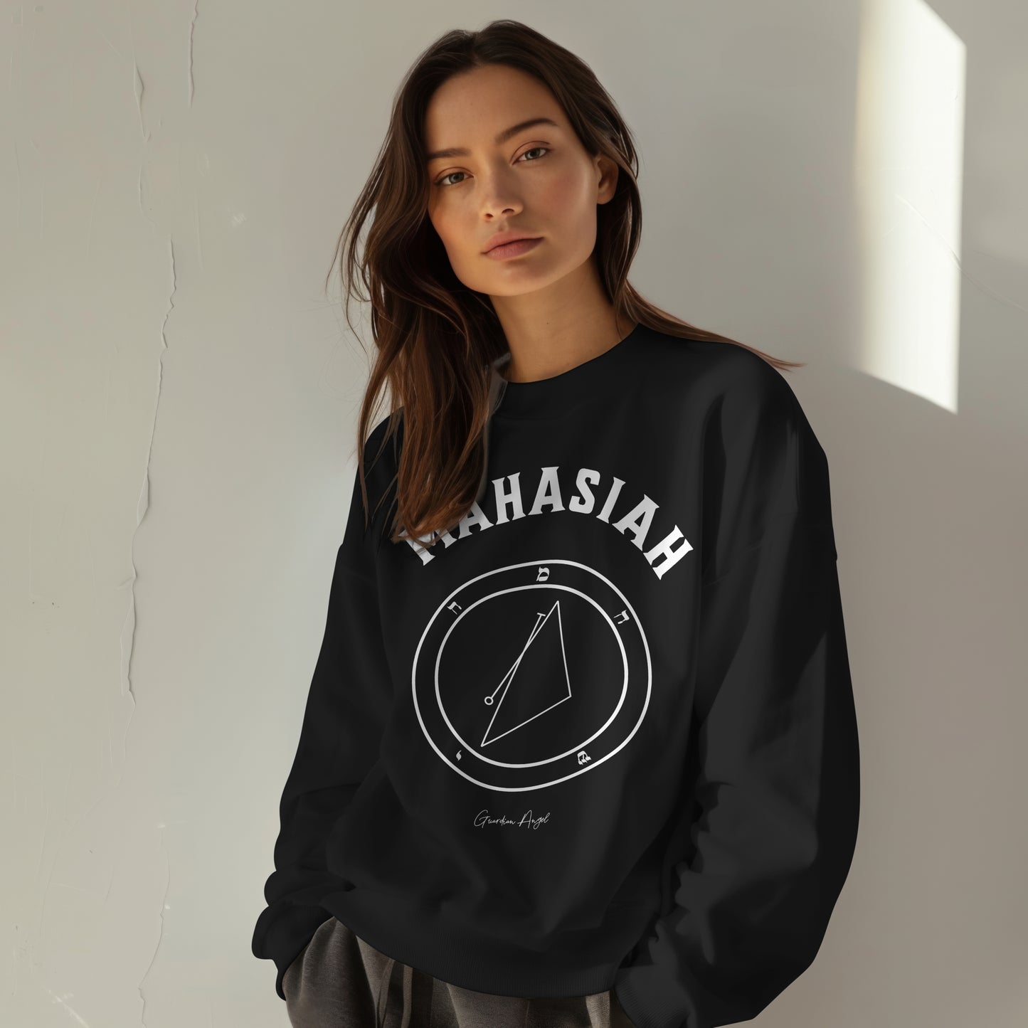 Model wearing a No.5 Shemhamphorasch Guardian Angel "Mahasiah" Sweatshirt in Black. With the seal of Mahasiah in white print on the front.