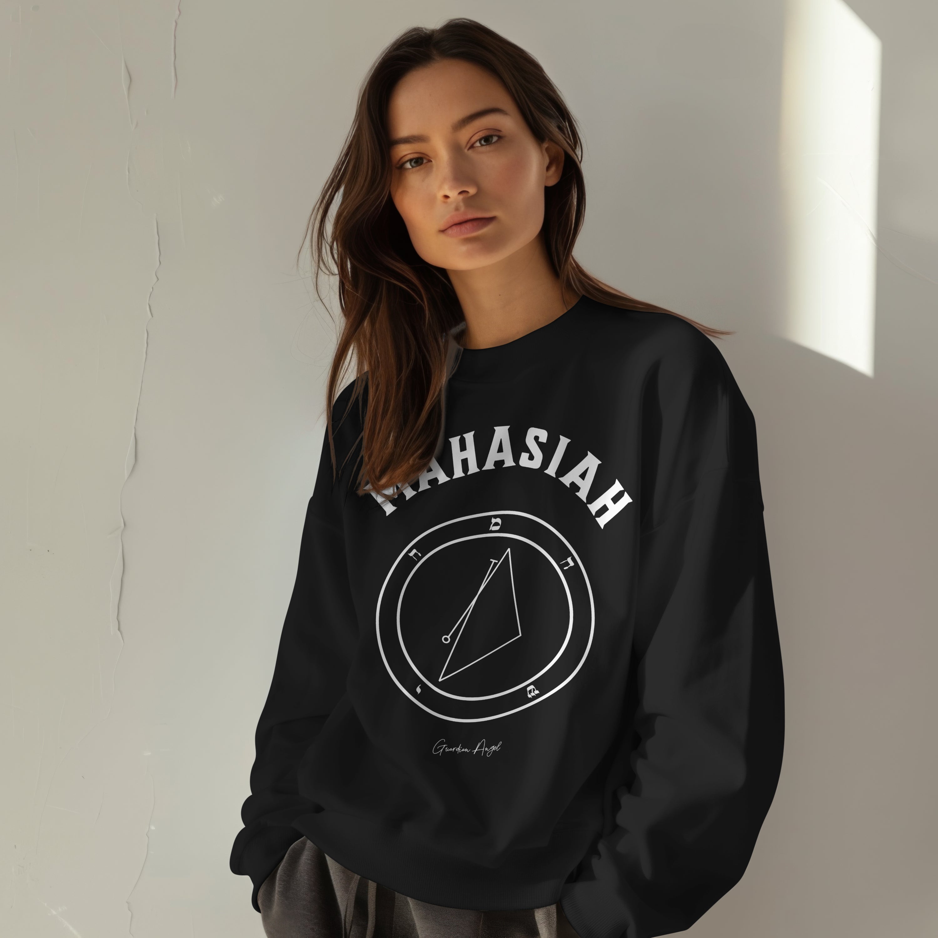 Model wearing a No.5 Shemhamphorasch Guardian Angel "Mahasiah" Sweatshirt in Black. With the seal of Mahasiah in white print on the front.