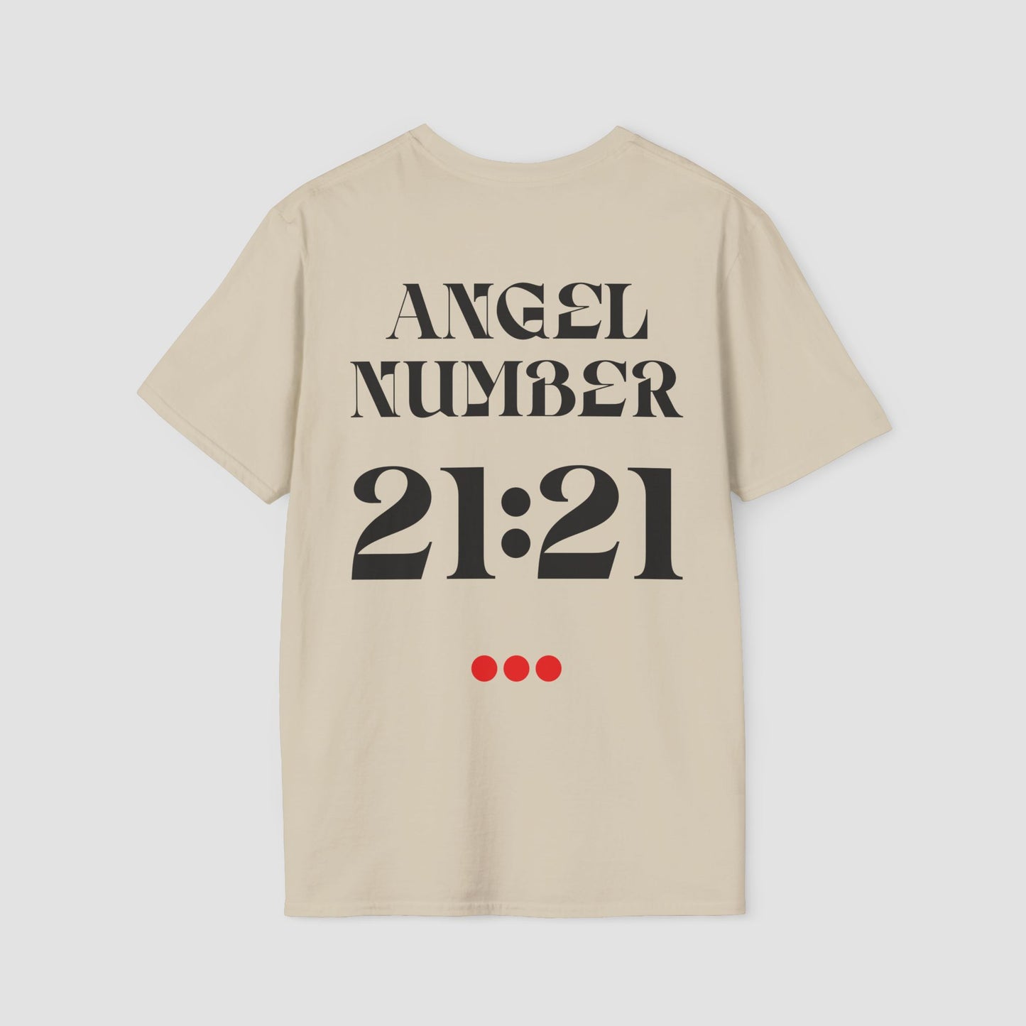 Sand coloured Tee with Angel Number 21:21 depicted on the back in black print and underscored by 3 red dots. A slogan is written across the front saying, "Read the signs" .