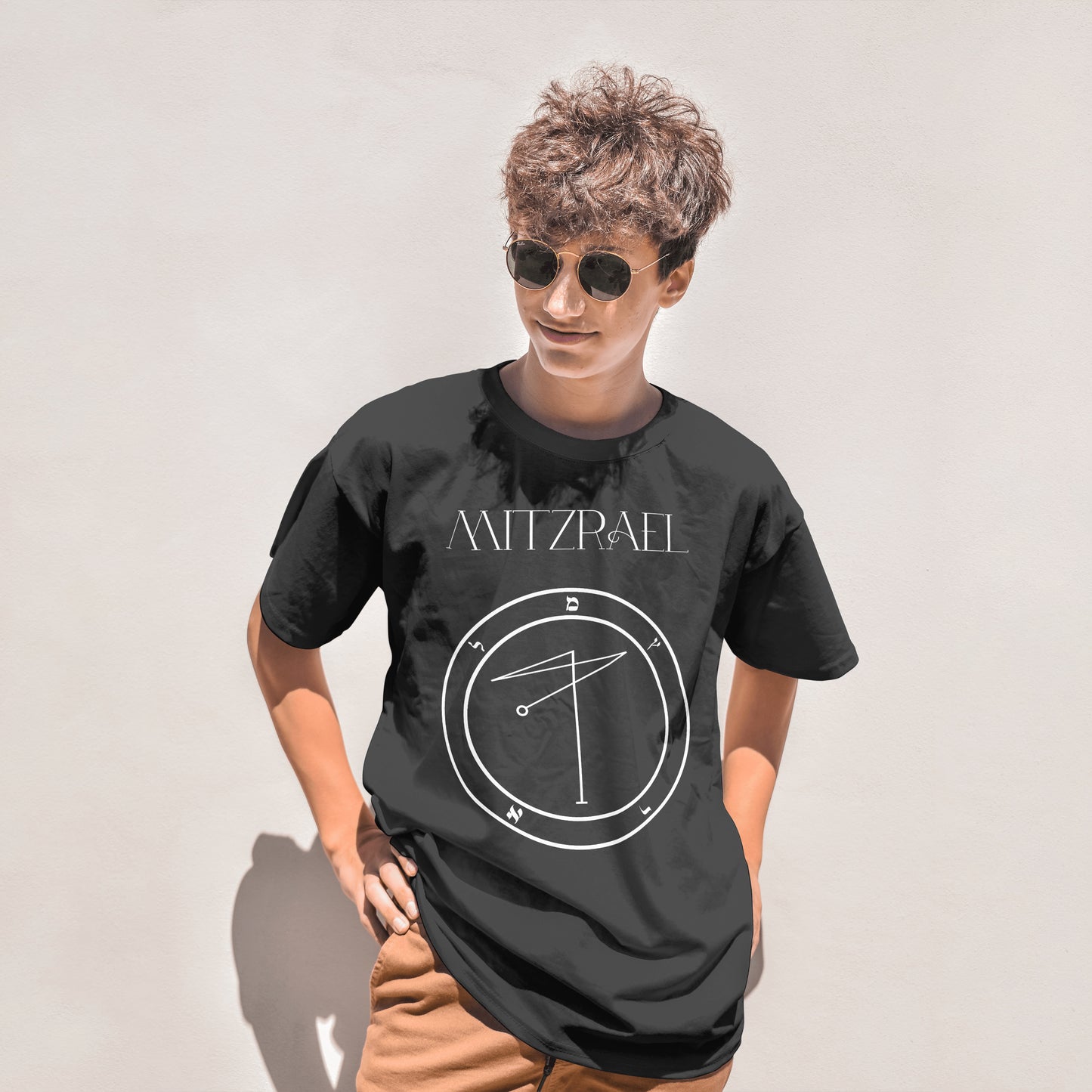 Model wearing No.60 Mitzrael Shem Hamephorash Guardian Angel T-Shirt in black with symbol of Mitzrael on front.