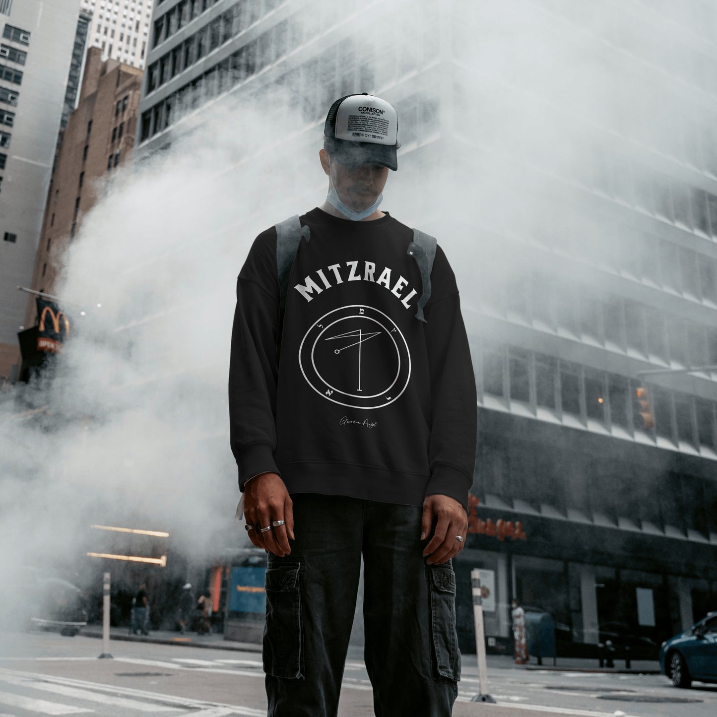 Model wearing a No.60 Shemhamphorasch Guardian Angel "Mitzrael" Sweatshirt in Black. With the seal of Mitzrael in white print on the front.