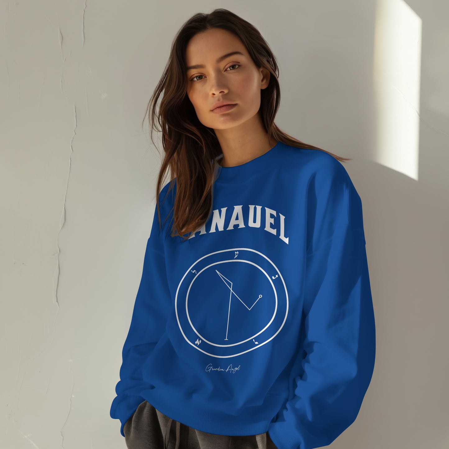 Model wearing a No.63 Shemhamphorasch Guardian Angel "Anauel" Sweatshirt in Royal Blue. With the seal of Anauel in white print on the front.