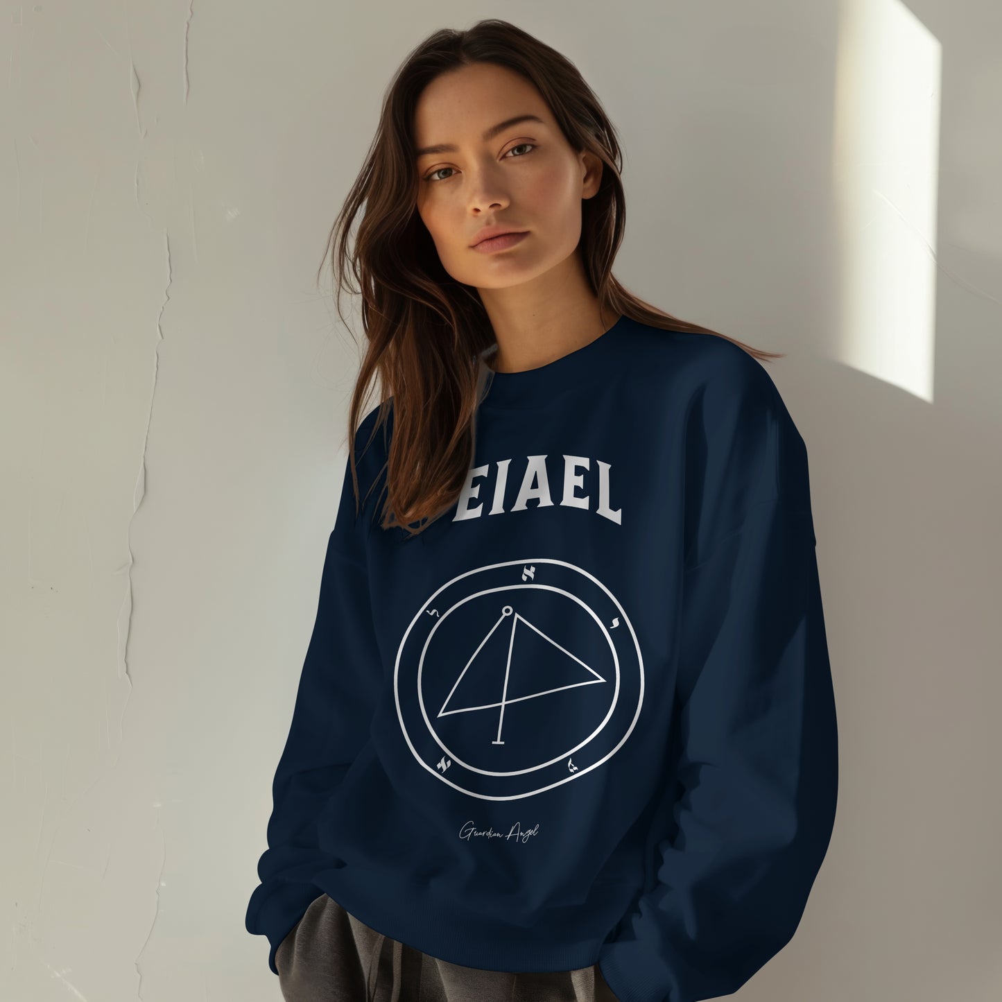 Model wearing a No.67 Shemhamphorasch Guardian Angel "Eiael" Sweatshirt in Navy. With the seal of Eiael in white print on the front.