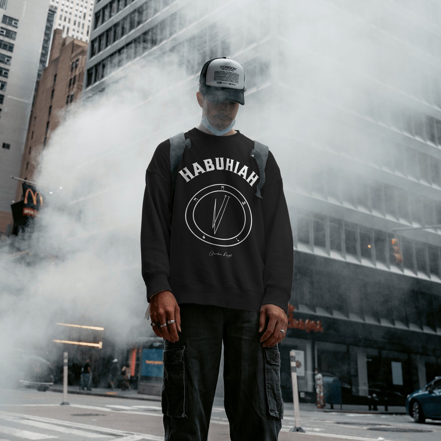 Model wearing a No.68 Shemhamphorasch Guardian Angel "Habuhiah" Sweatshirt in Black. With the seal of Habuhiah in white print on the front.