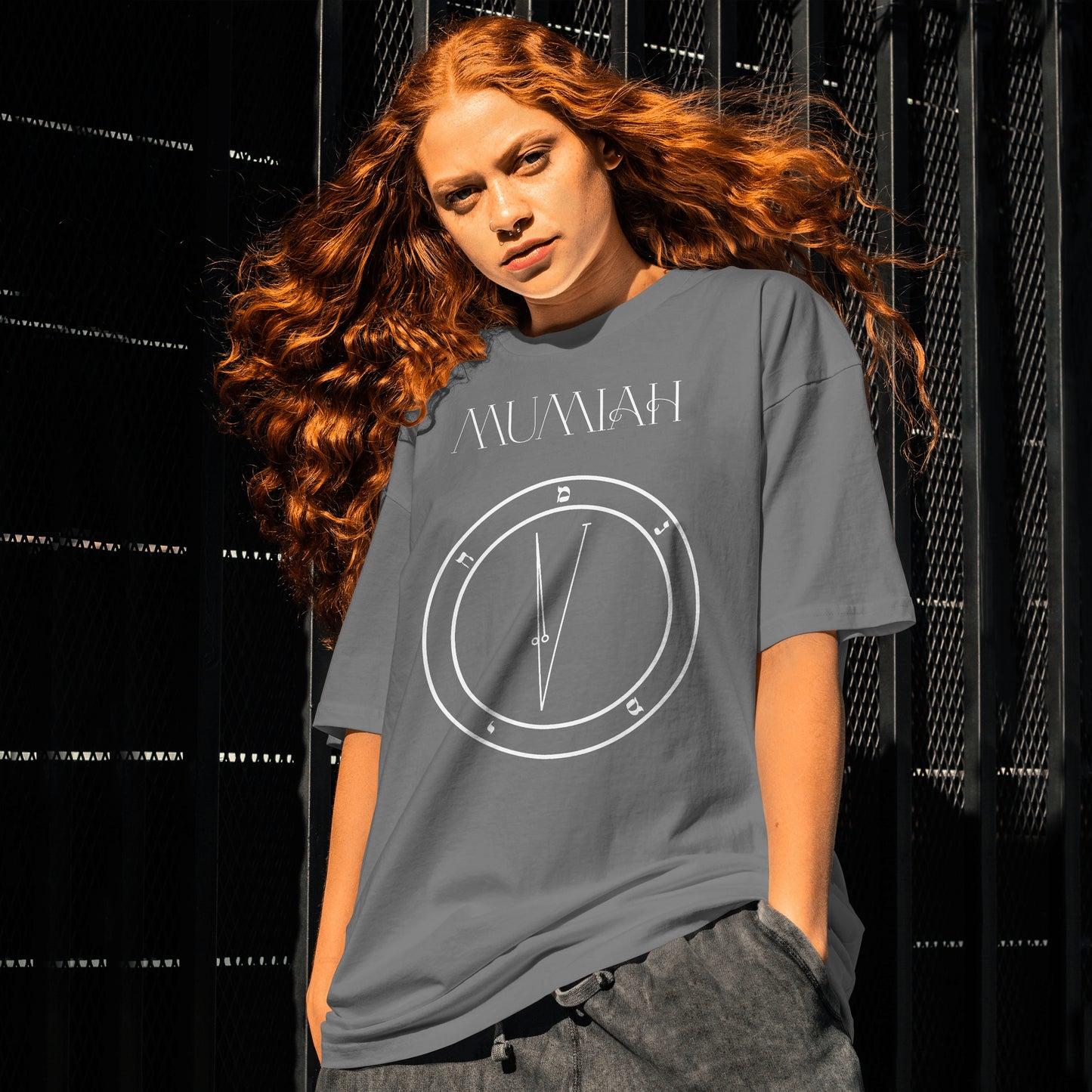 Model wearing No.72_Mumiah Hamephorash Guardian Angel T-Shirt in charcoal with symbol of Mumiah on front.