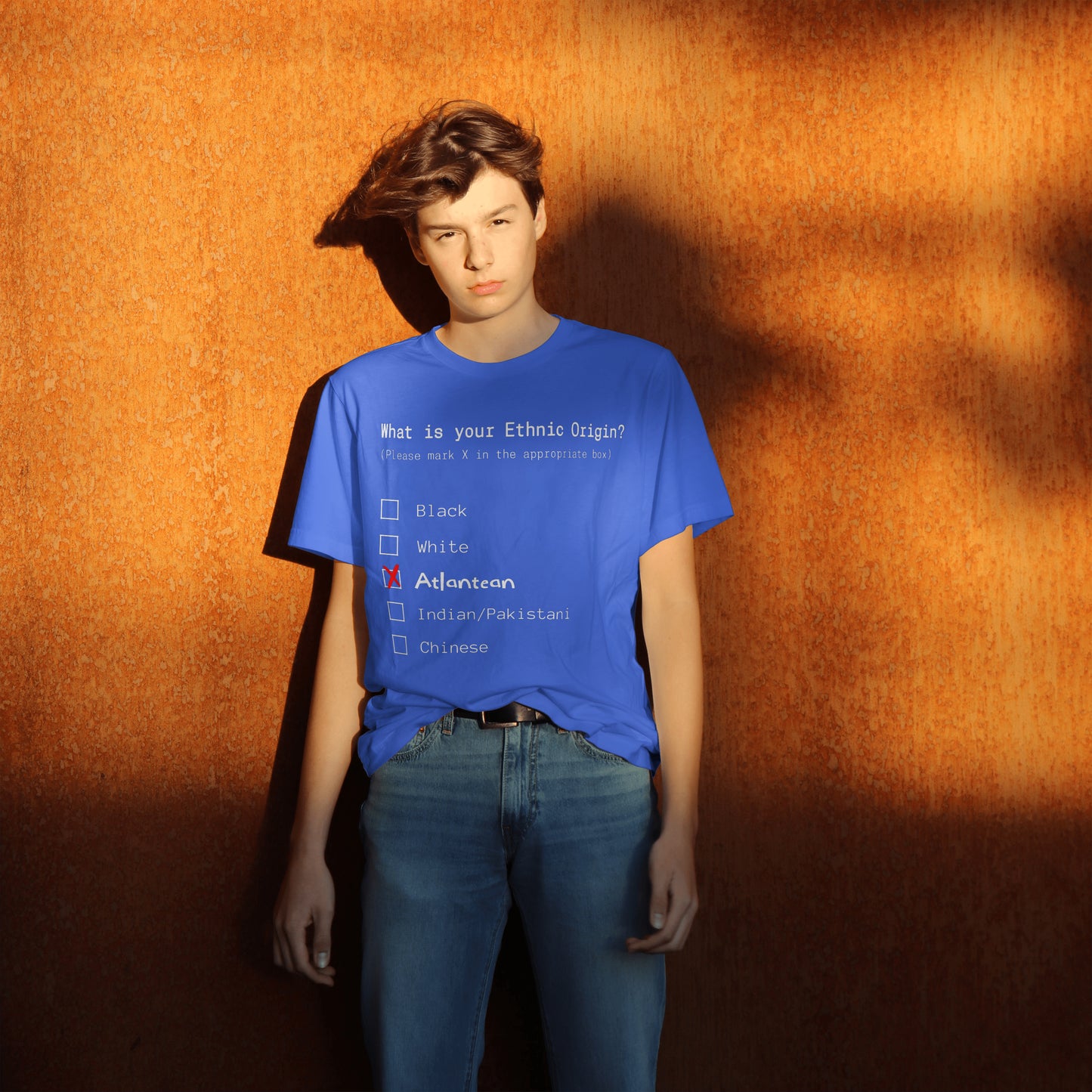 Person wearing a blue t-shirt with a racial profiling questionnaire on an orange background