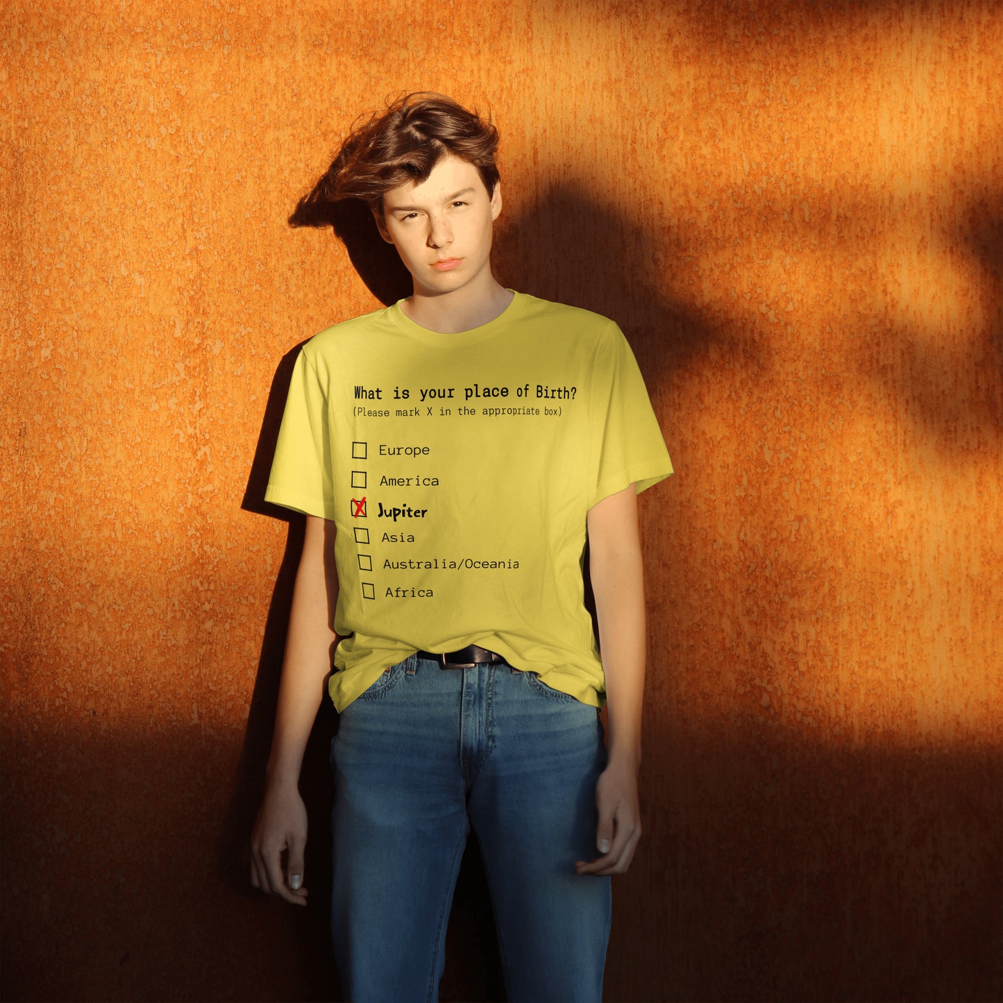 Person wearing a yellow t-shirt with text and checkboxes on an orange background