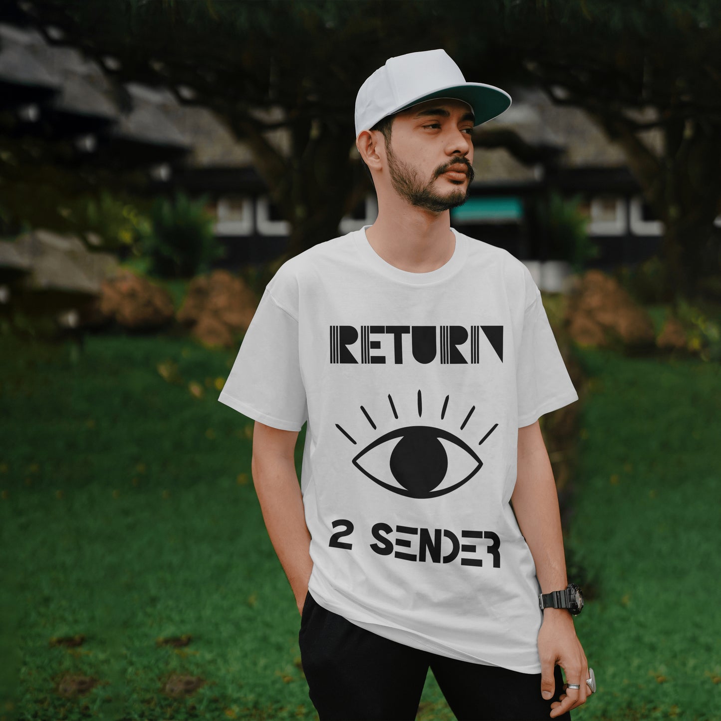 Model wearing a White T-Shirt with large White evil eye emblem on the front and the words Return 2 Sender.