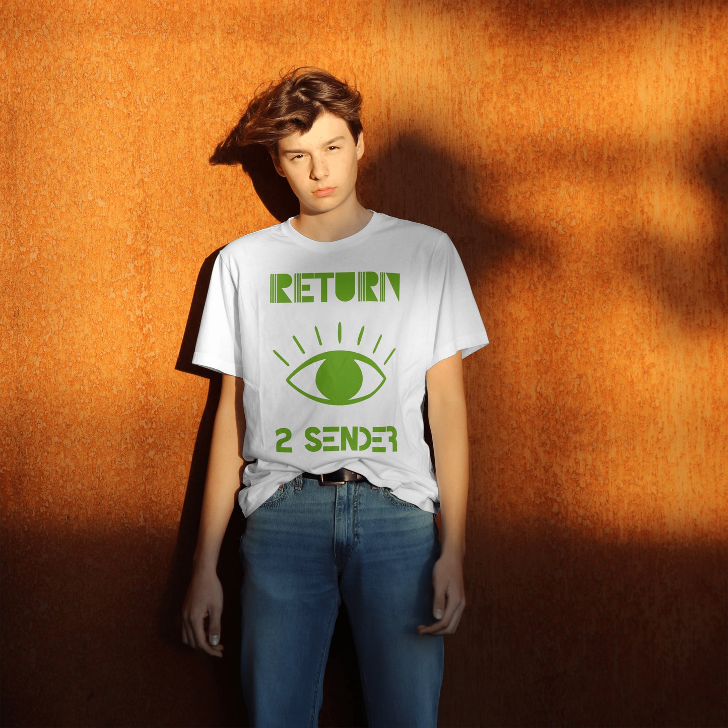 Model wearing a White T-Shirt with large Green evil eye emblem on the front and the words Return 2 Sender.
