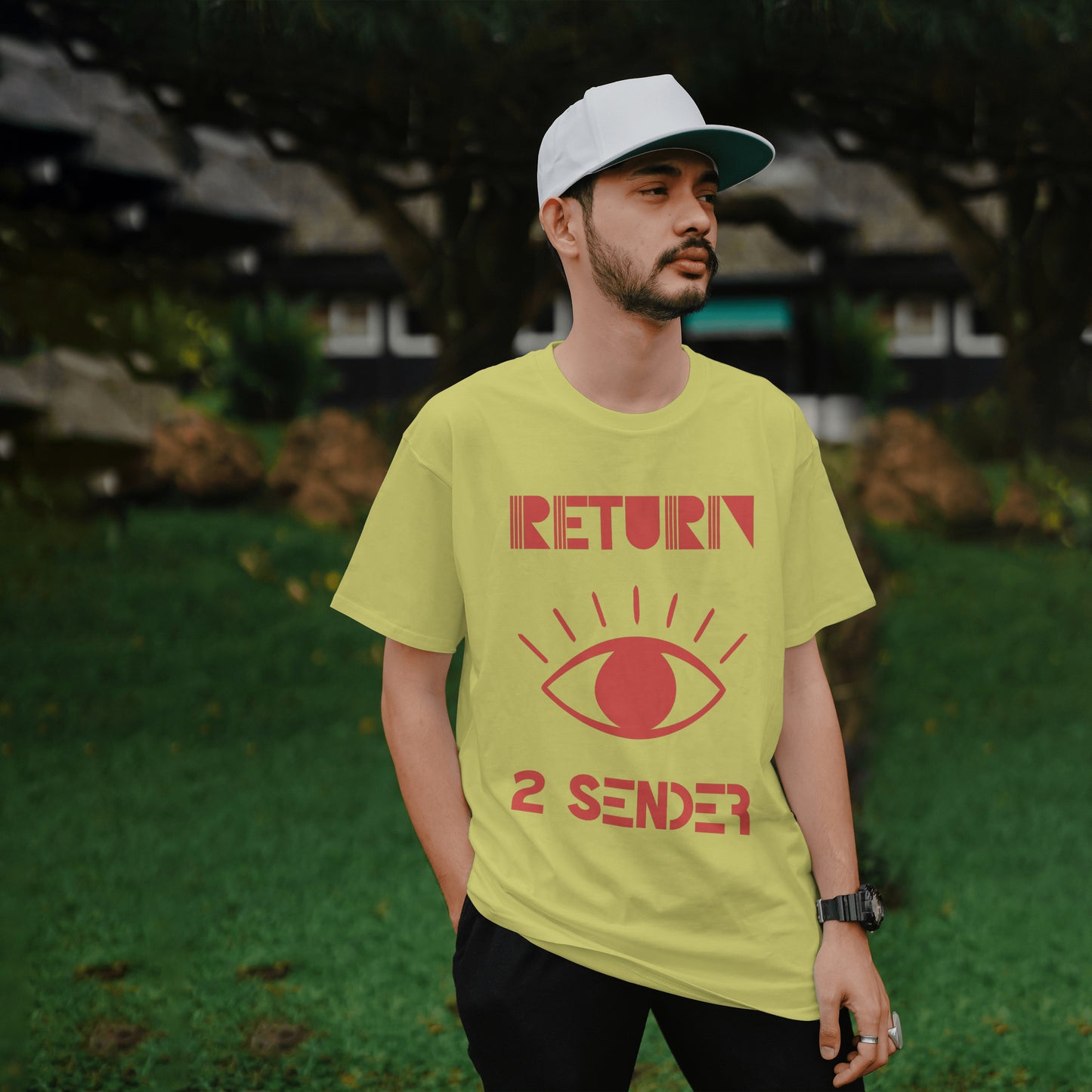 Model wearing a yellow T-Shirt with large Red evil eye emblem on the front and the words Return 2 Sender.