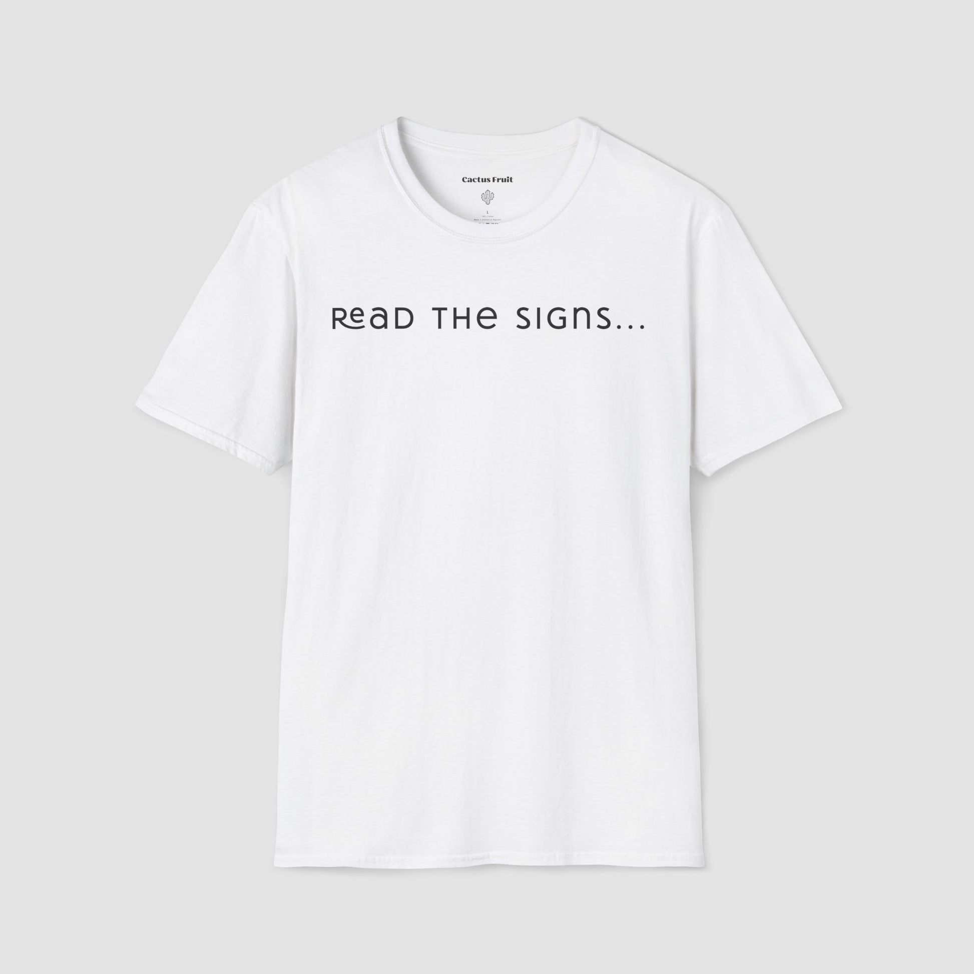 White t-shirt with 'READ THE SIGNS...' text on a light gray background