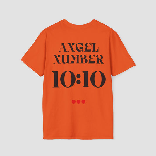 Orange t-shirt with 'ANGEL NUMBER 10:10' text on a light gray background