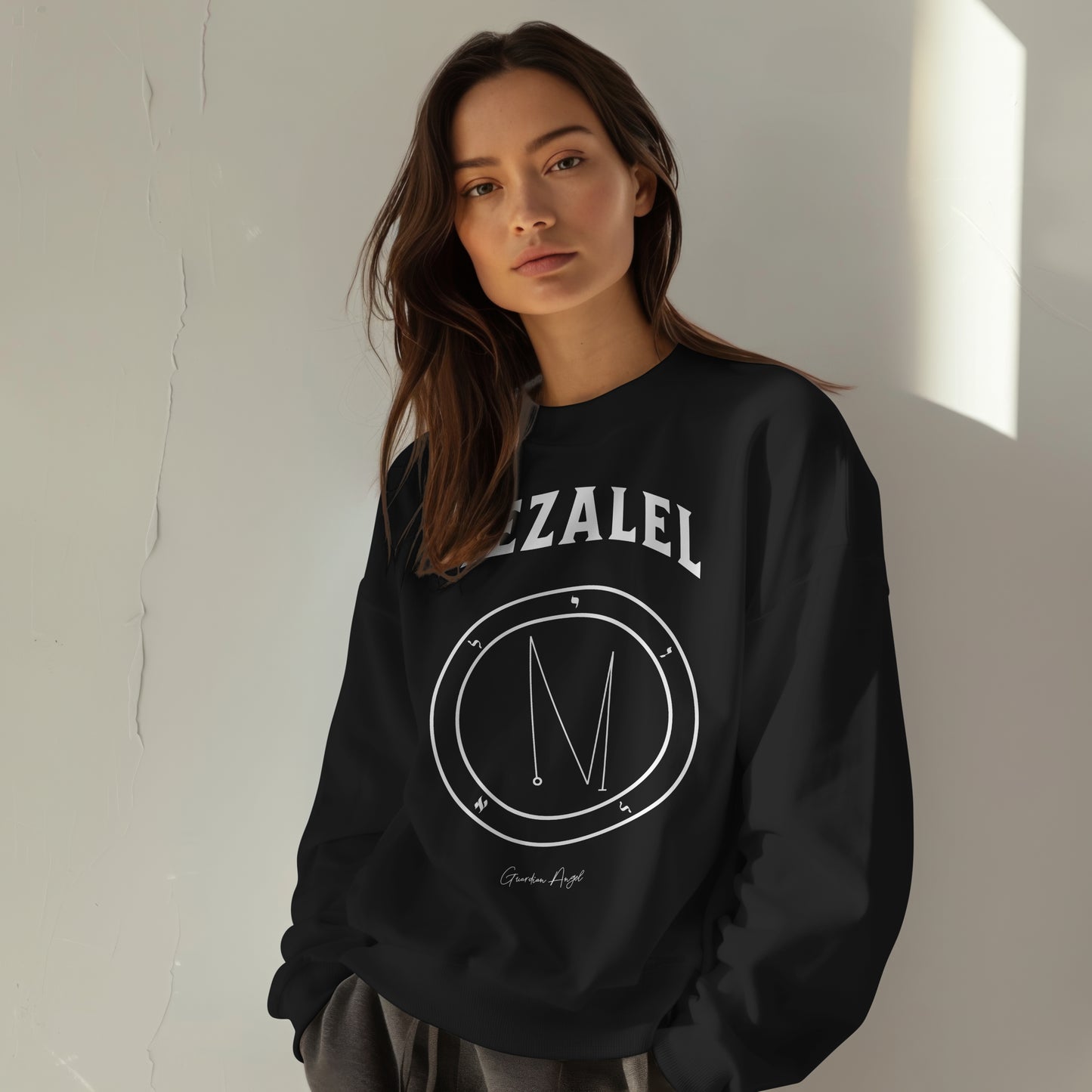 Model wearing a No.13 Shemhamphorasch Guardian Angel "Iezalel"  Sweatshirt  in Black. With the seal of Iezalel in white print on the front. 
