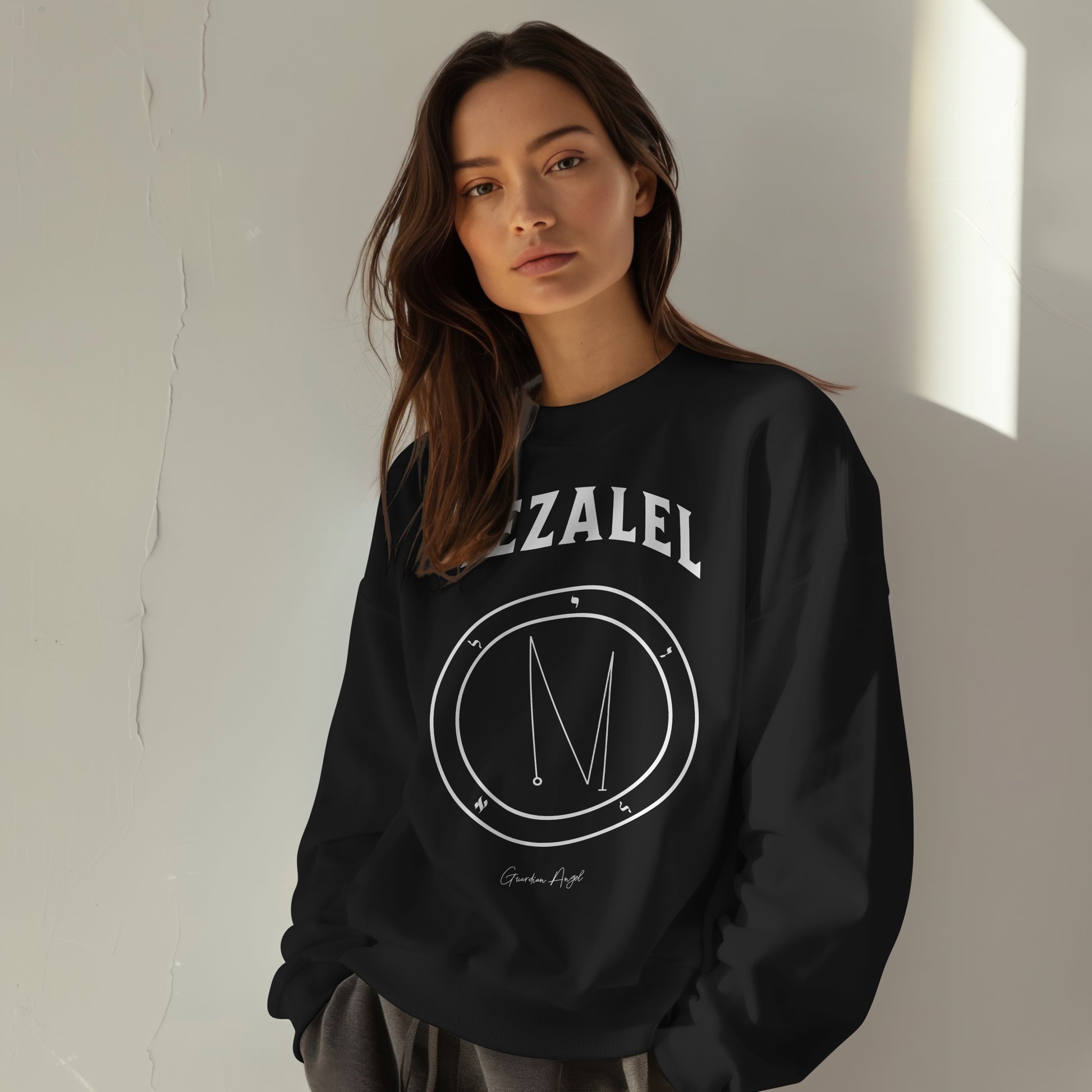 Model wearing a No.13 Shemhamphorasch Guardian Angel "Iezalel"  Sweatshirt  in Black. With the seal of Iezalel in white print on the front. 