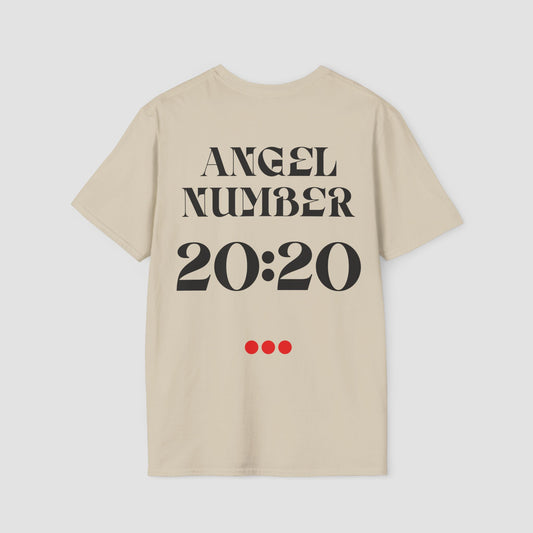 Sand coloured Tee with Angel Number 20:20 depicted on the back in black  print and underscored by 3 red dots. A slogan is written across the front saying, "Read the signs" . 