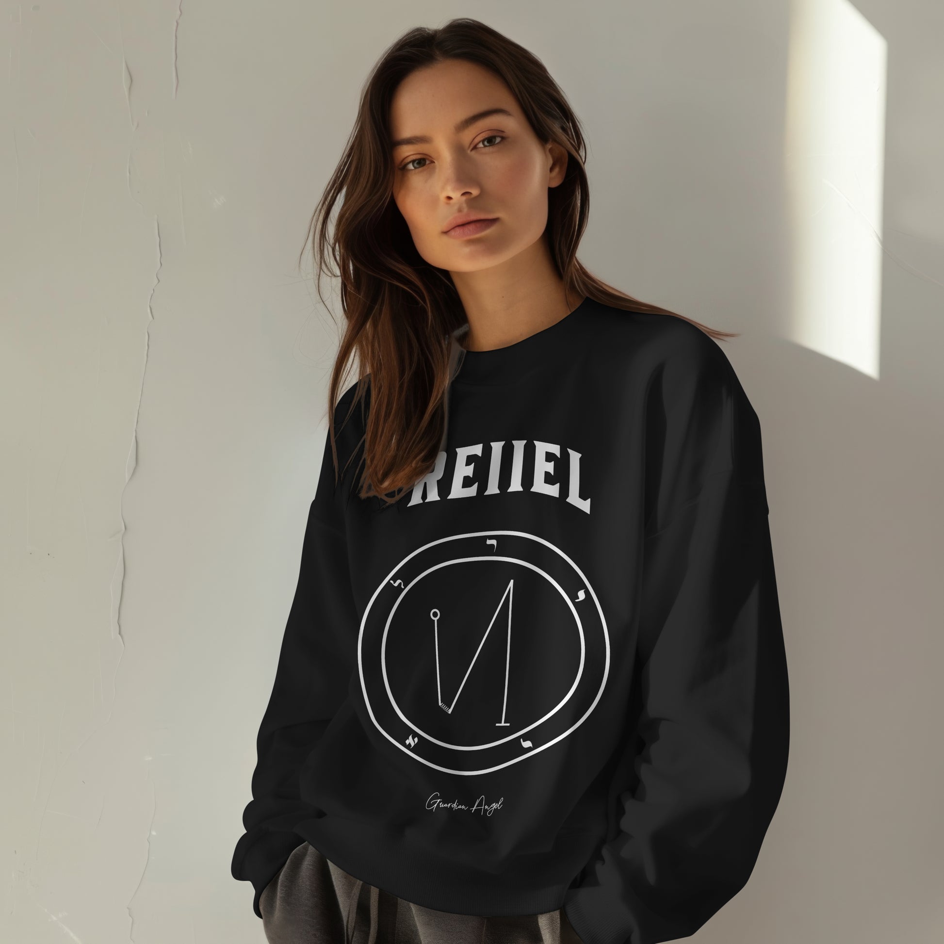 Model wearing a No.29 Shemhamphorasch Guardian Angel "Reiiel"  Sweatshirt  in Black. With the seal of Reiiel in white print on the front.