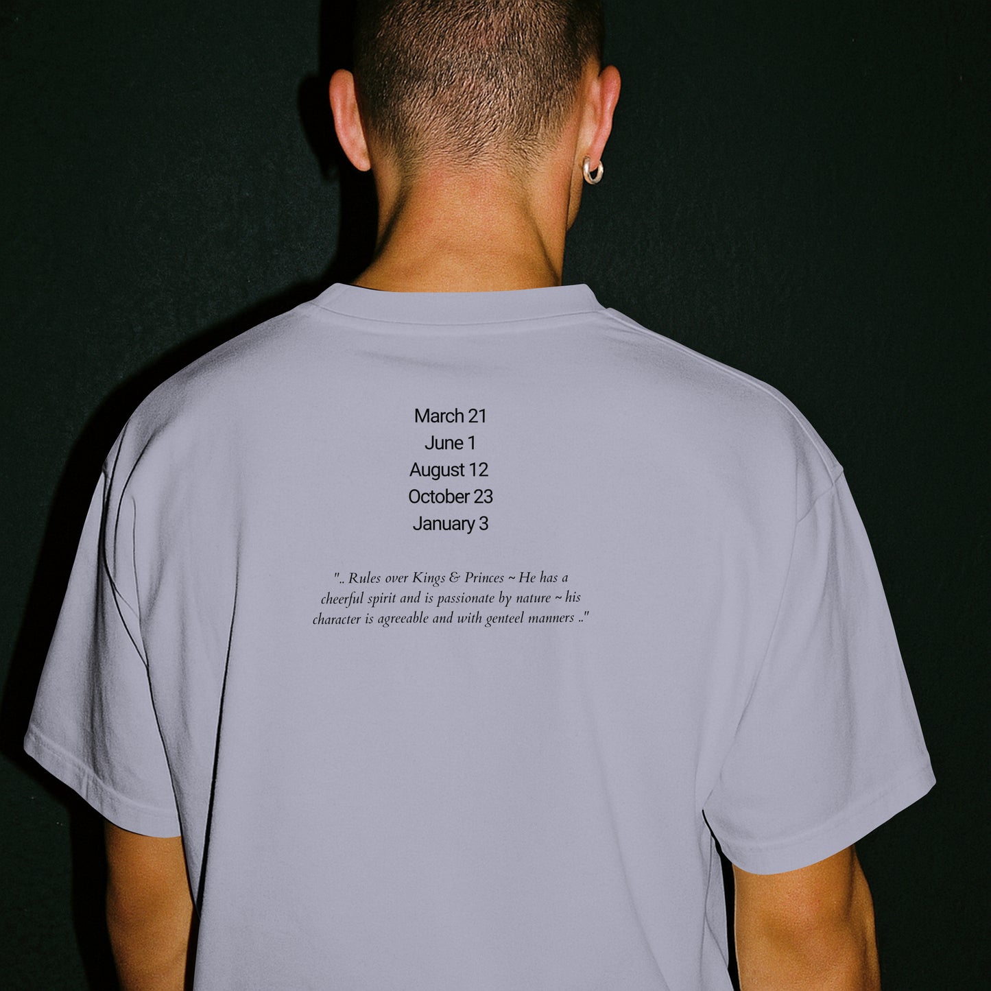 Model wearing a Jeliel Guardian Angel T-Shirt in Lavender with attributes of Jeliel written on the back.