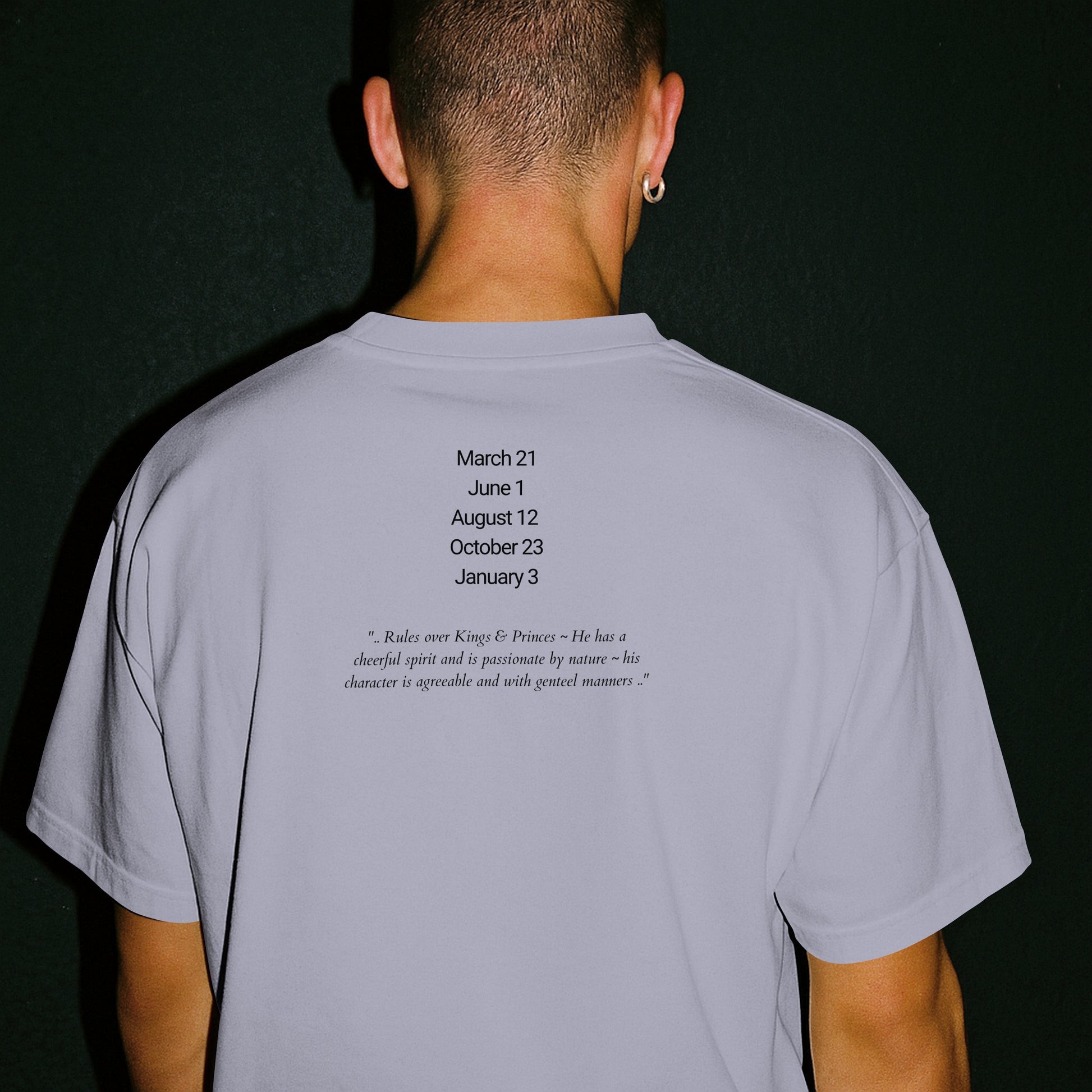 Model wearing a Jeliel Guardian Angel T-Shirt in Lavender with attributes of Jeliel written on the back.