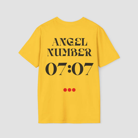 Yellow t-shirt with 'ANGEL NUMBER 07:07' printed on the back against a light gray background