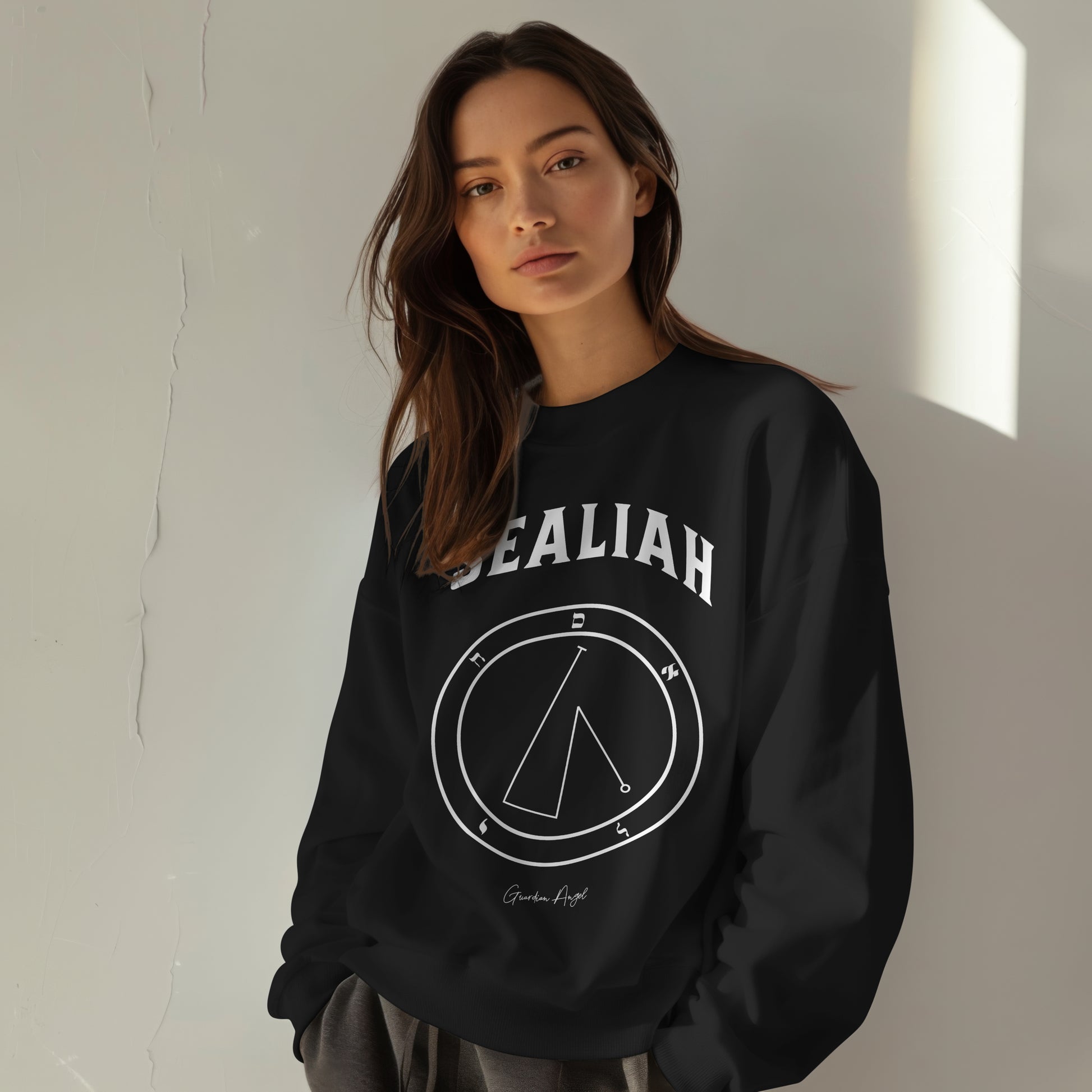 Model wearing a No.45 Shemhamphorasch Guardian Angel "Sealiah"  Sweatshirt  in Black. With the seal of Sealiah in white print on the front.