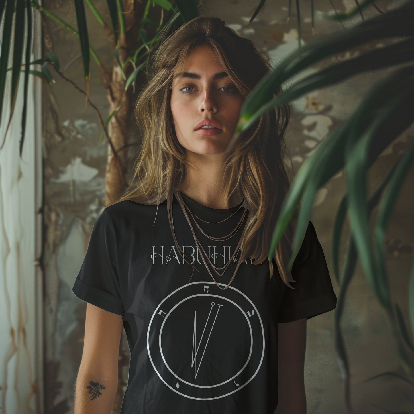 Model wearing No.68 Habuhiah Shem Hamephorash Guardian Angel T-Shirt in black with symbol of Habuhiah on front. 
