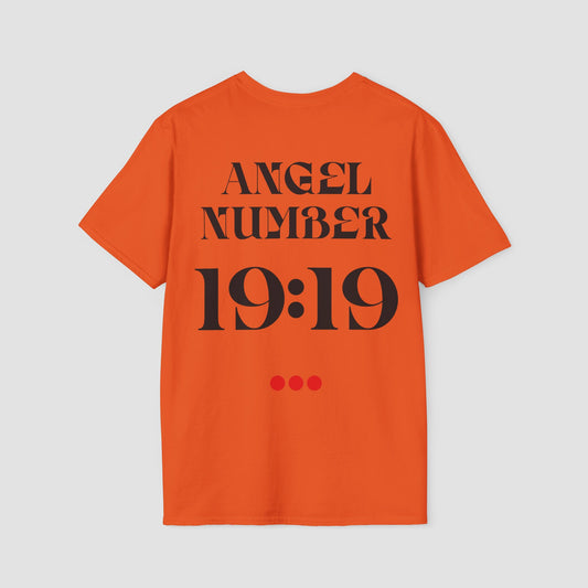 Orange Tee with Angel Number 19:19 depicted on the back in black print and underscored by 3 red dots. A slogan is written across the front saying, "Read the signs" .